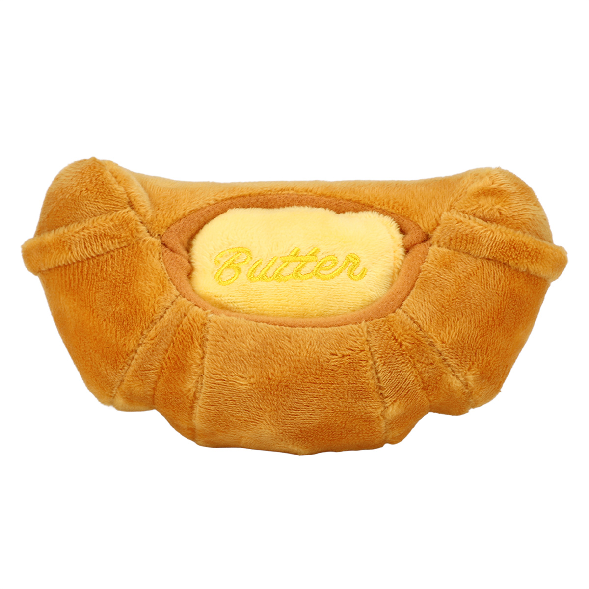 Braunes Plüsch-Croissant-Spielzeug mit gelber Füllung und 'Butter'.