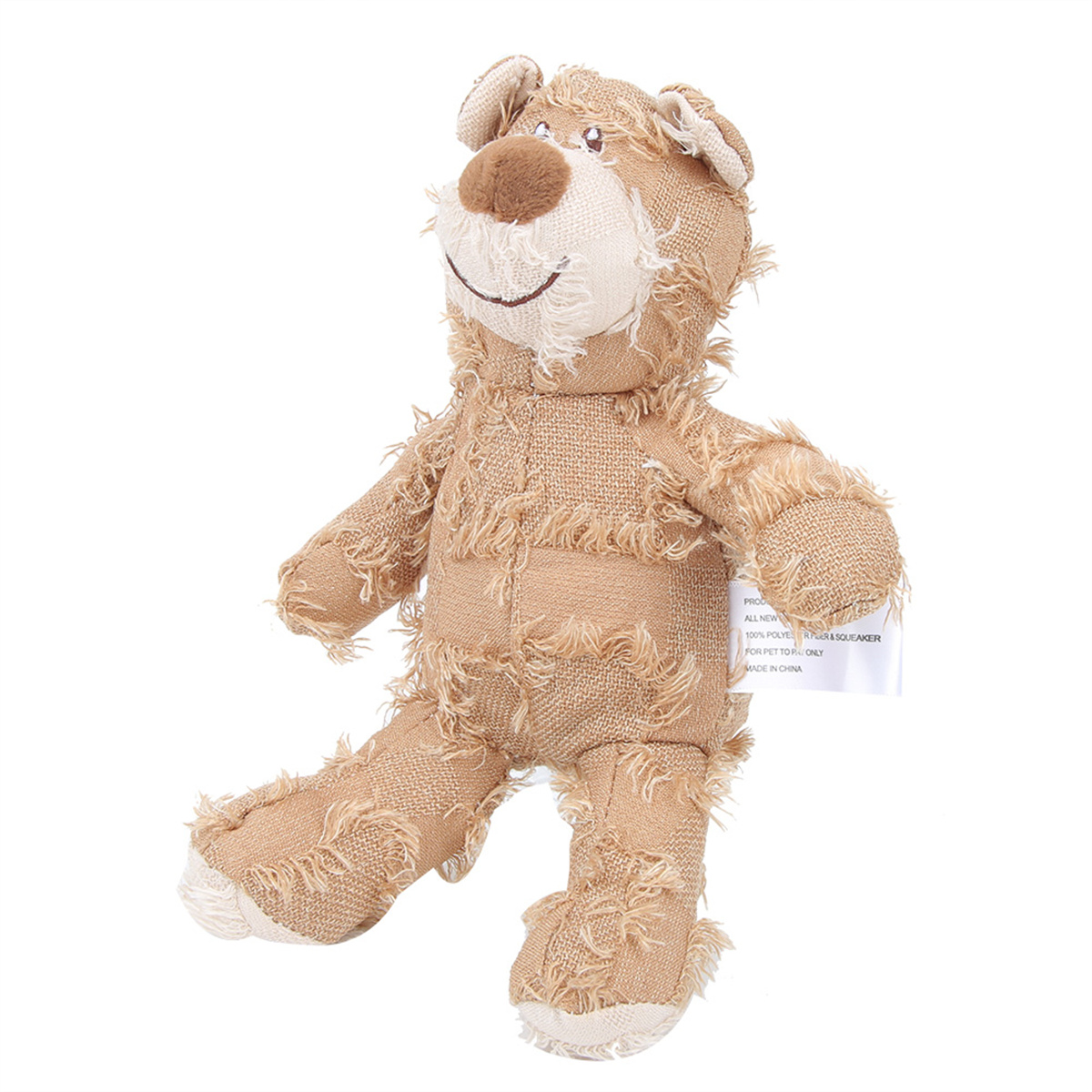Hellbraunes Teddybär-Spielzeug mit ausgefransten Kanten und einem Etikett.