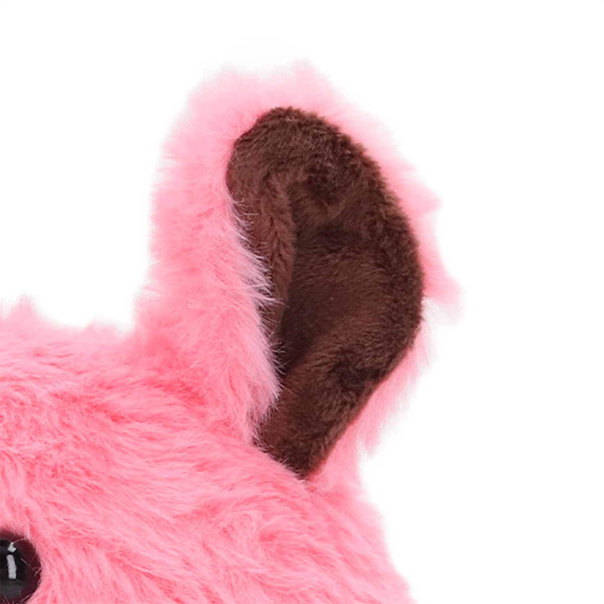 Nahaufnahme eines rosa, flauschigen Ohrs mit braunem Innenohr.