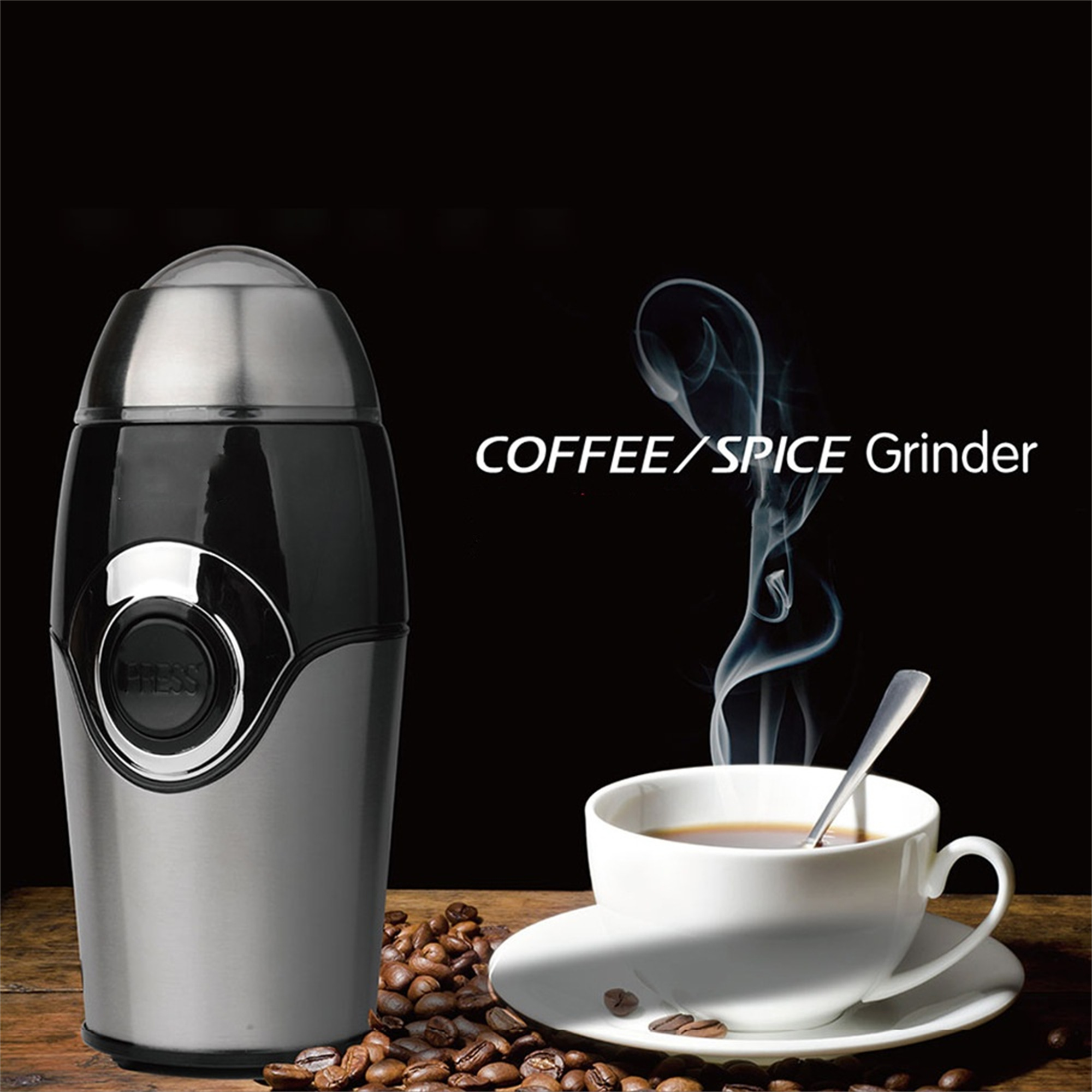 Eine Kaffeemühle und eine Tasse Kaffee mit aufsteigendem Dampf, mit verstreuten Kaffeebohnen.