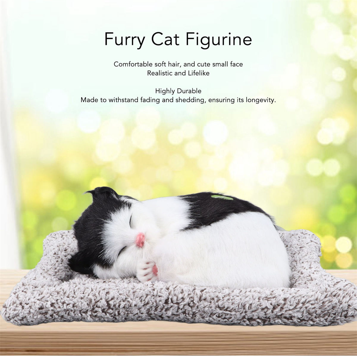 Schlafende Katzenfigur. Schwarz-weiße Katze auf grauem Bett. Weich und realistisch.