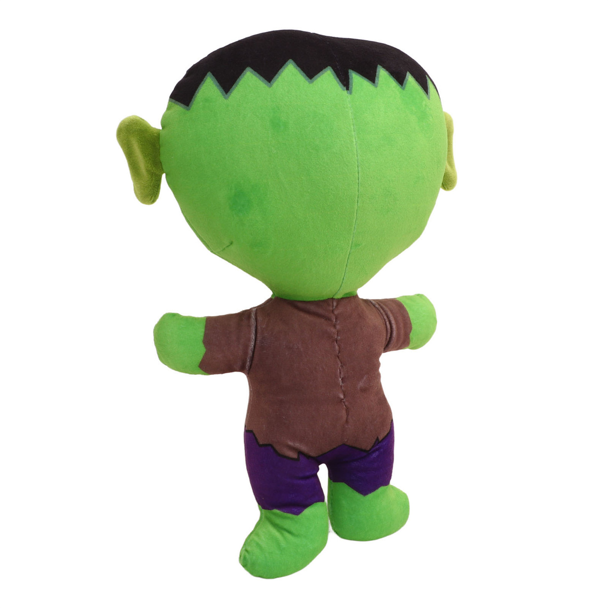 Grünes Frankenstein-Plüschtier von hinten, braunes Hemd, lila Hose, grüne Füße, schwarze Haare und zwei kleine grüne Ohren.