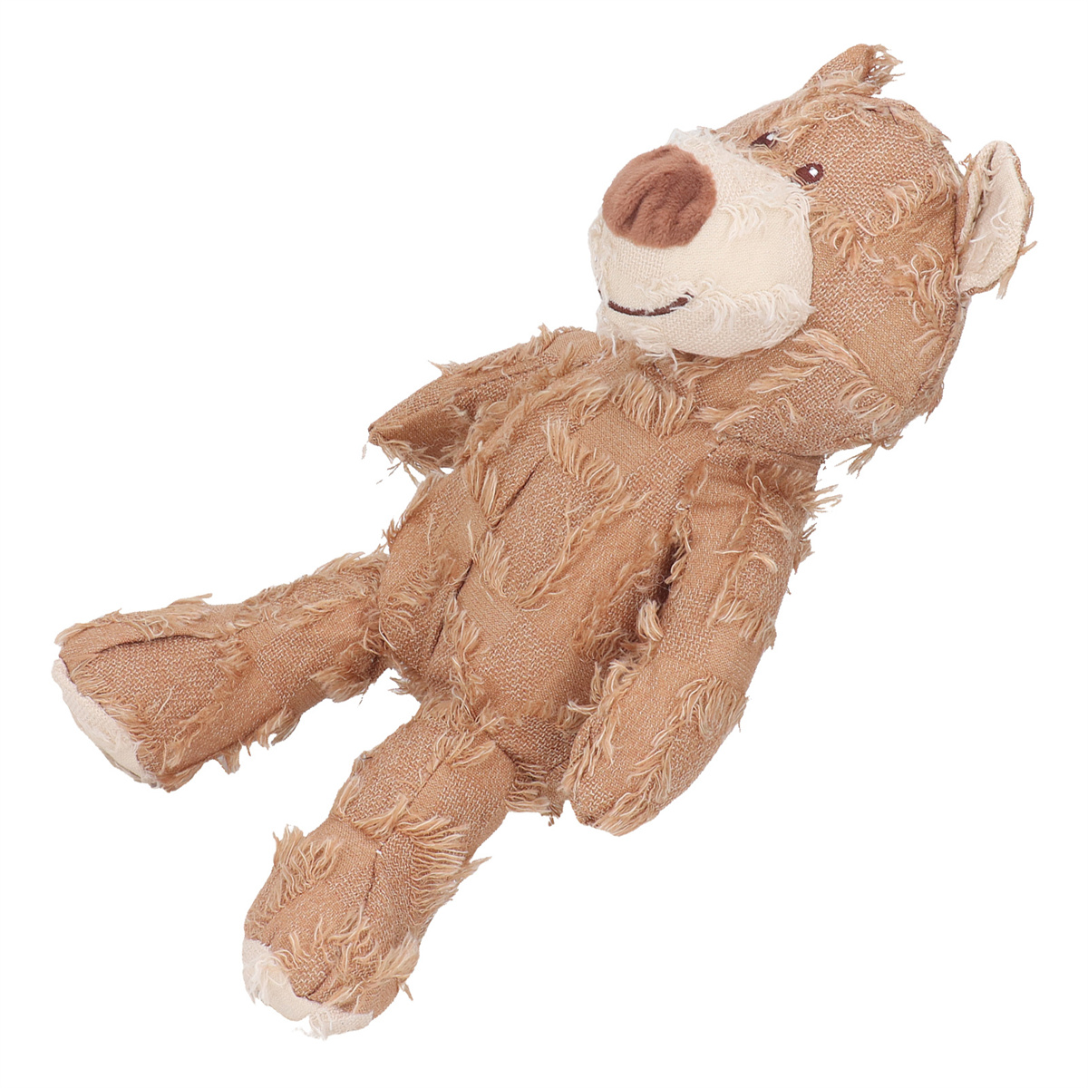 Ein abgenutzter Teddybär, der auf der Seite liegt, mit sichtbaren Nähten und einem lächelnden Gesicht.