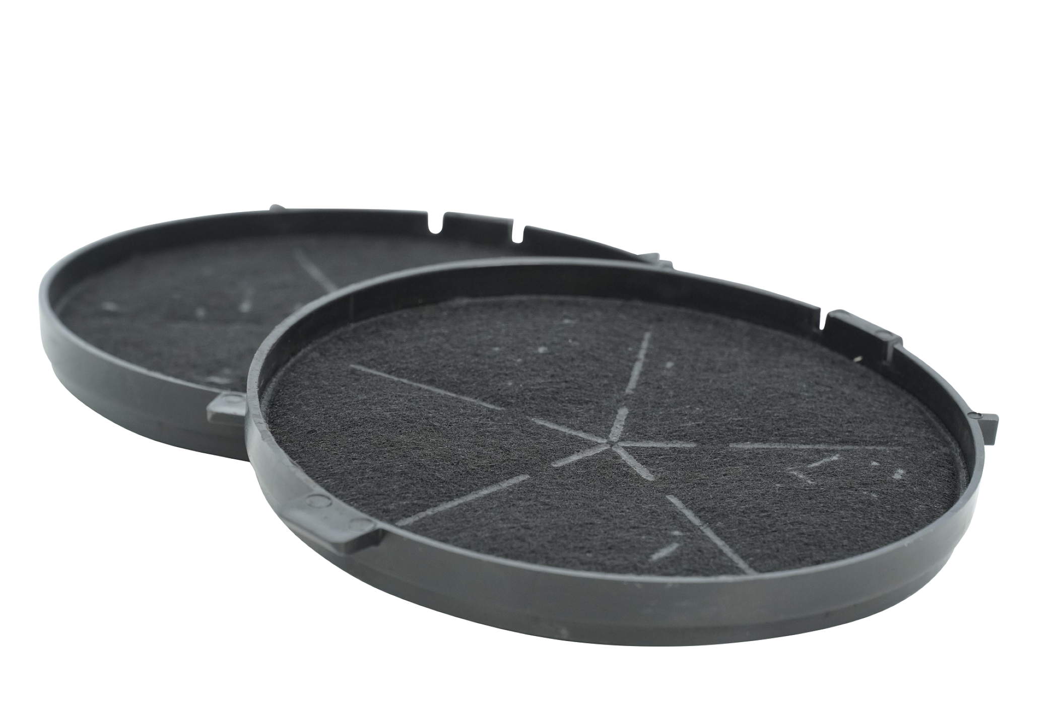 Two circular black air filters with a star-shaped pattern on the surface are isolated on a white background.