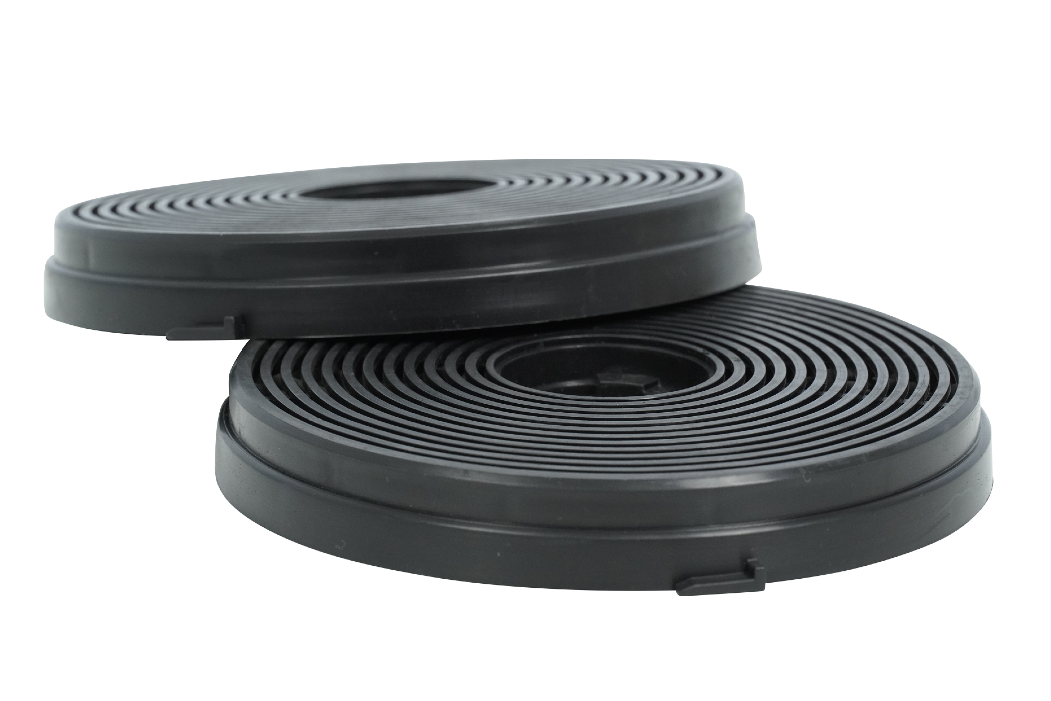 Two black carbon filters, stacked. White background.
