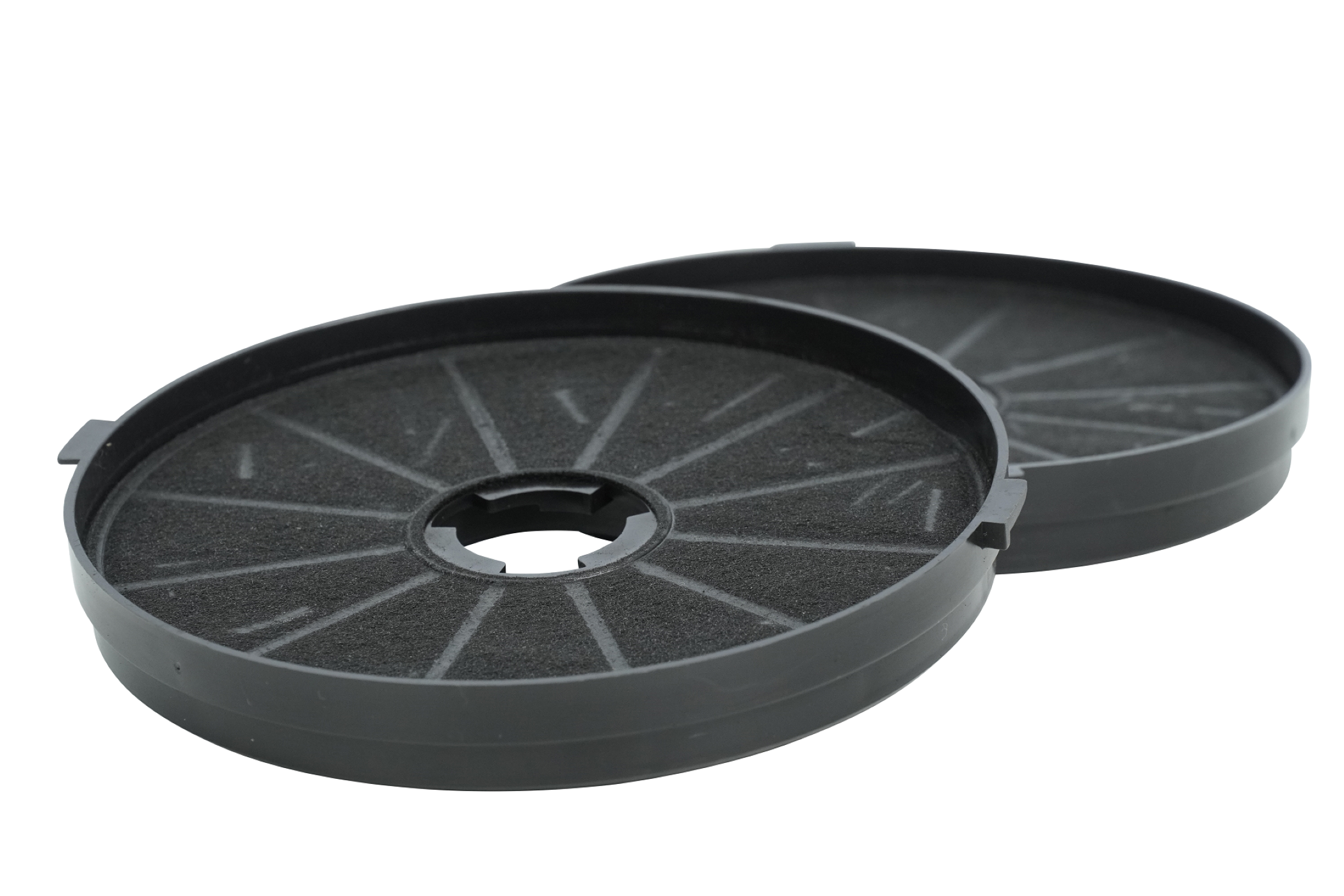 Two black charcoal filters, circular with porous surfaces, against a white background.