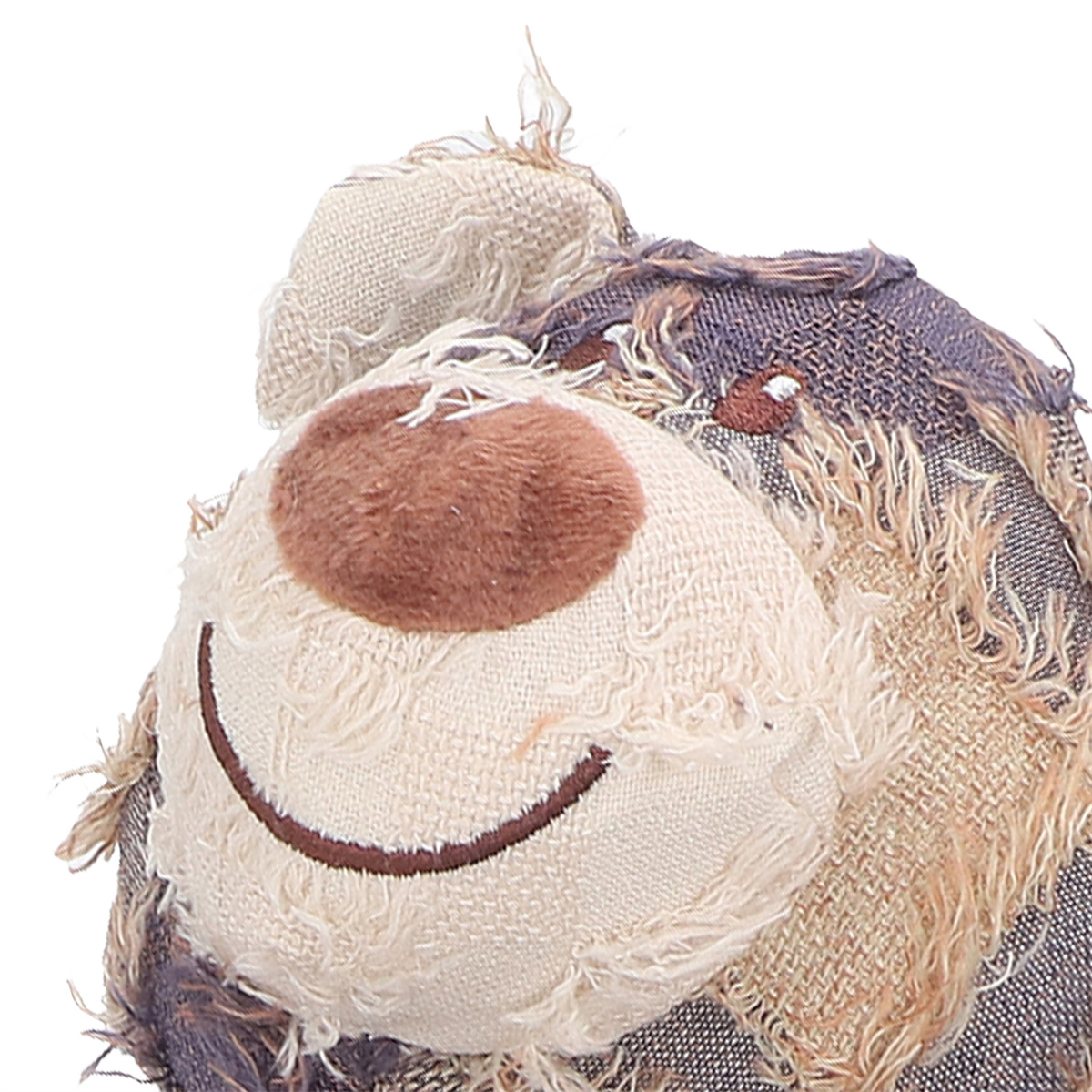 Ein Stofftier-Hundekopf mit einem lächelnden Gesicht.
