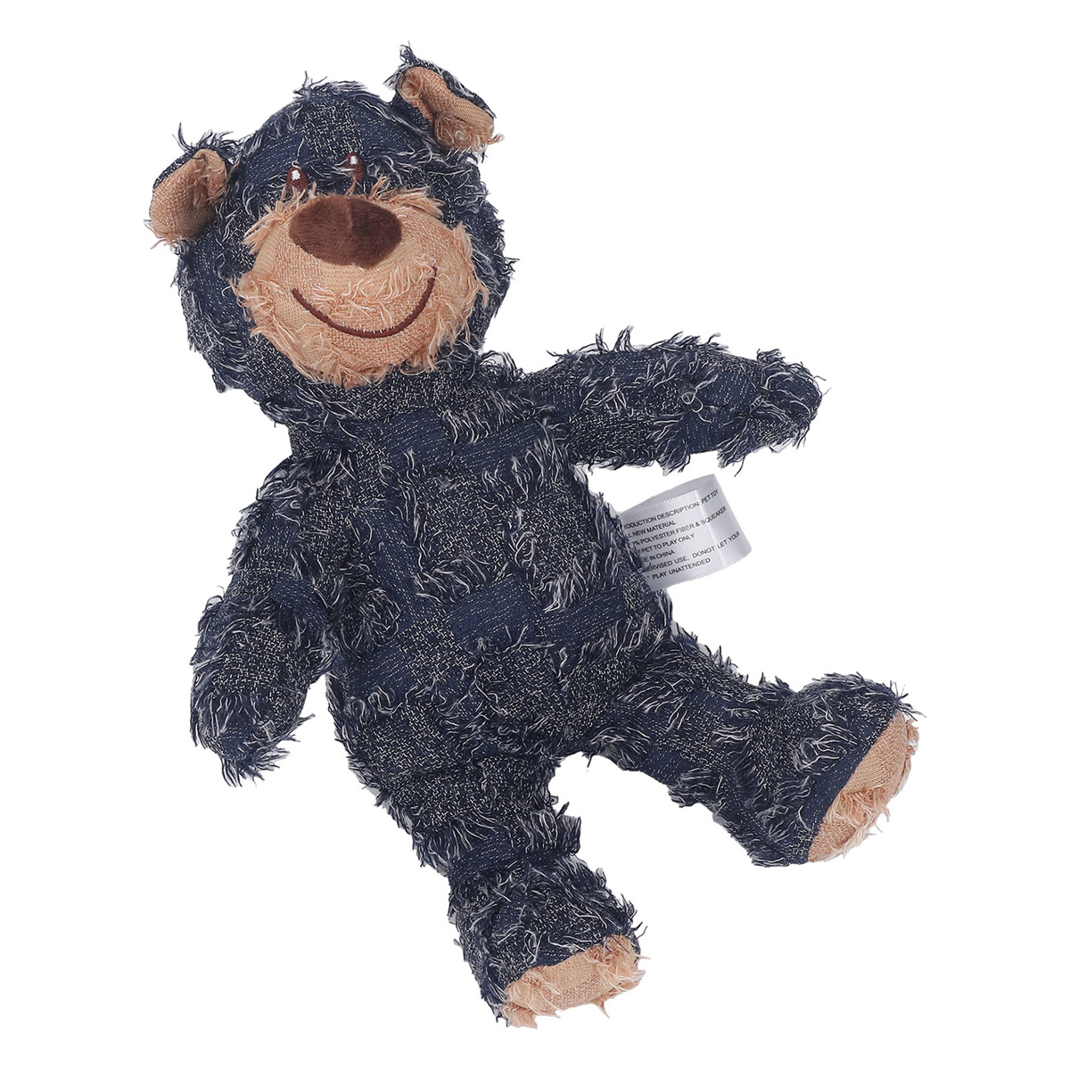 Blaues Denim-Teddybär-Spielzeug, das liegt, mit einem lächelnden Gesicht. Weißer Hintergrund.