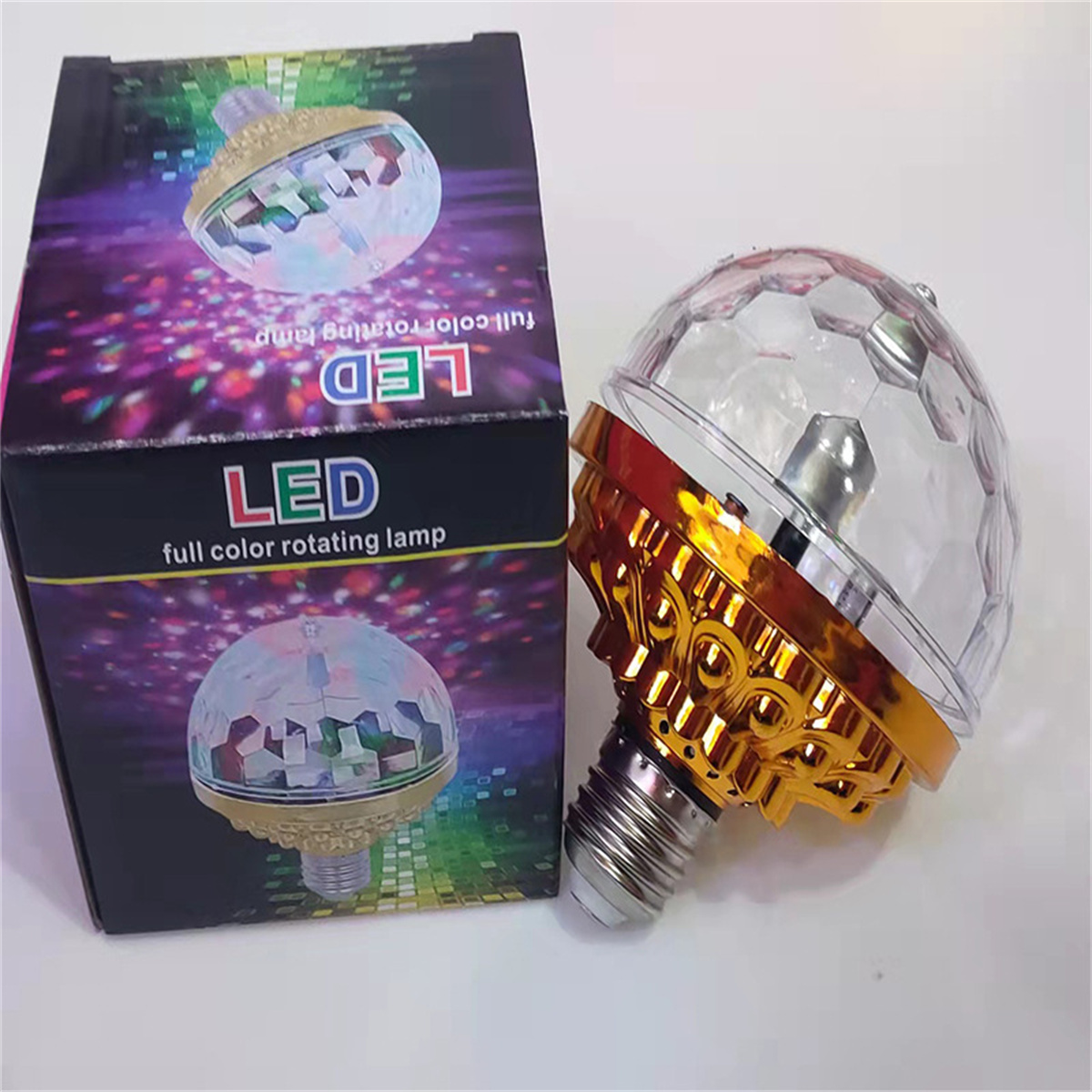 LED-Vollfarb-Rotationslampe. Produkt und Box stehen auf weißem Untergrund.