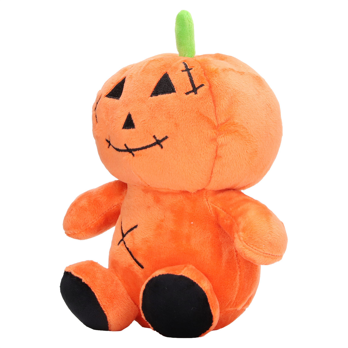 Ein plüschiges, orangefarbenes Kürbisspielzeug mit grünem Stiel, schwarzen Augen und einem genähten Mund und Kreuzen.
