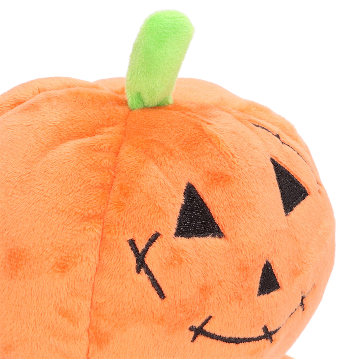 Nahaufnahme eines Halloween-Kürbis-Plüschtiers mit grünem Stiel.