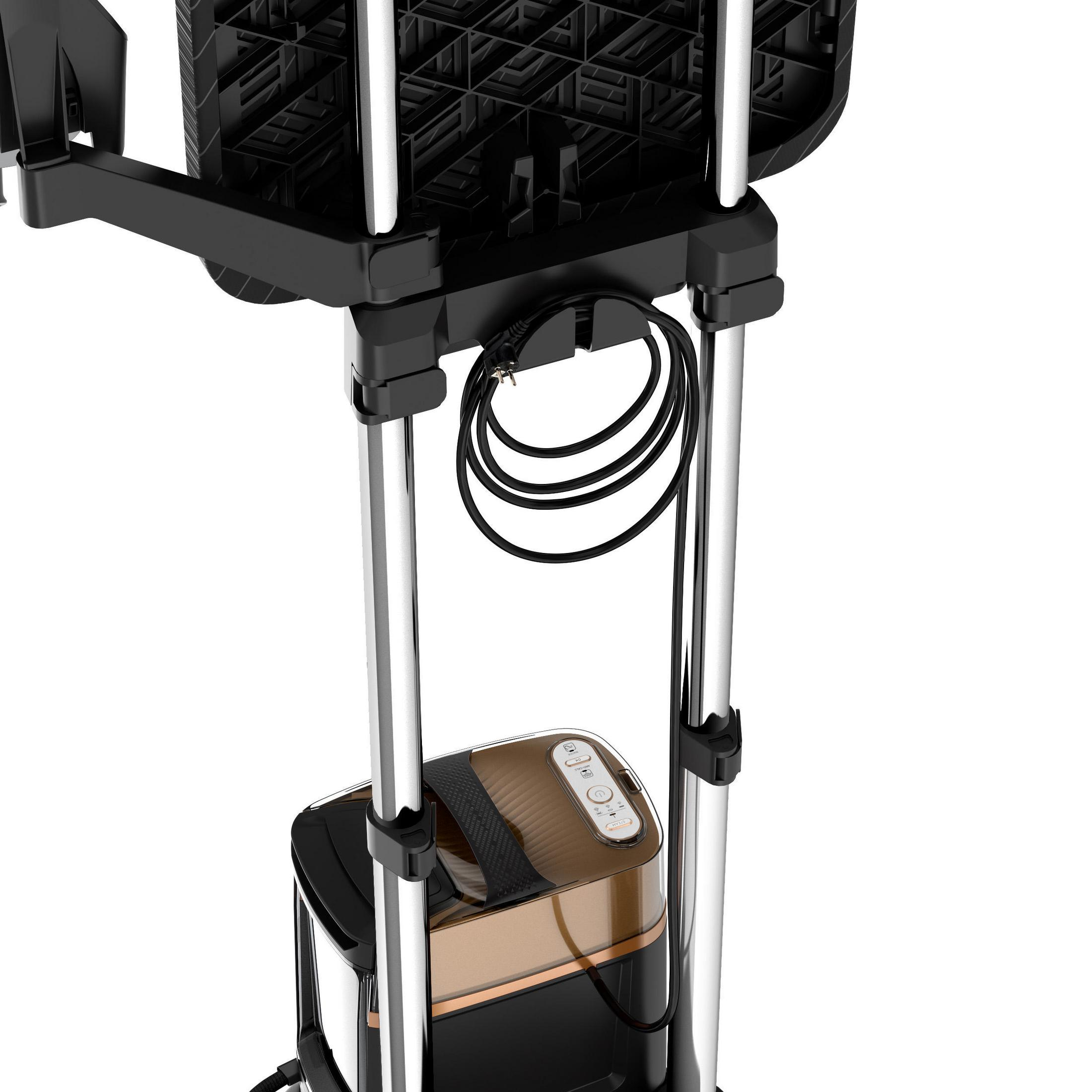 Czarny i złoty parownik do ubrań, stojący, z wiszącym kablem zasilającym.