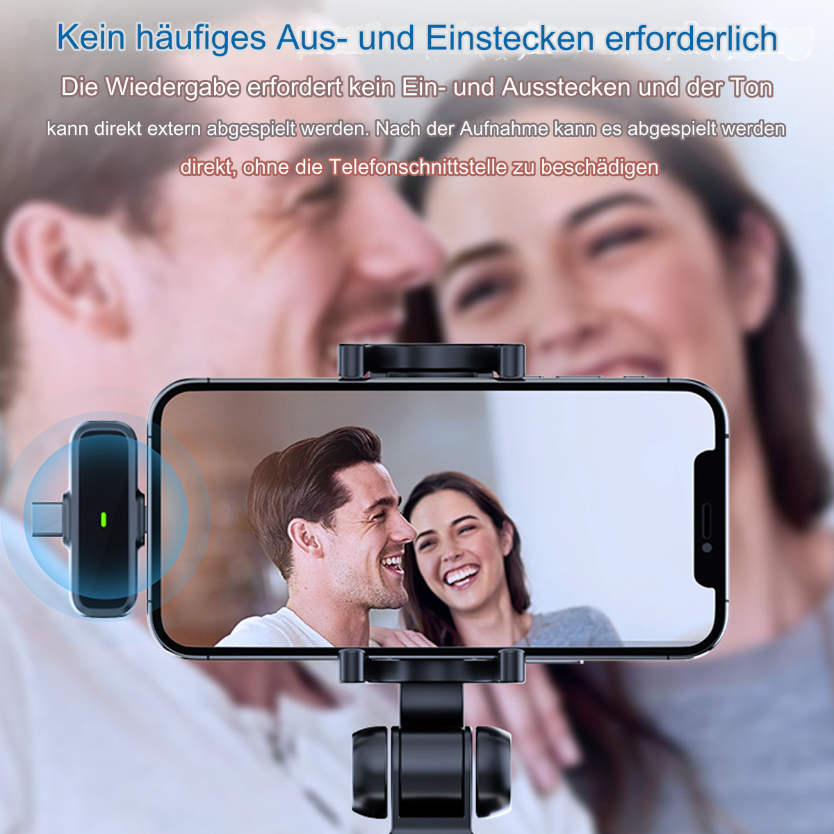 Telefon auf Halterung, zwei Personen im Hintergrund. Text auf Deutsch.