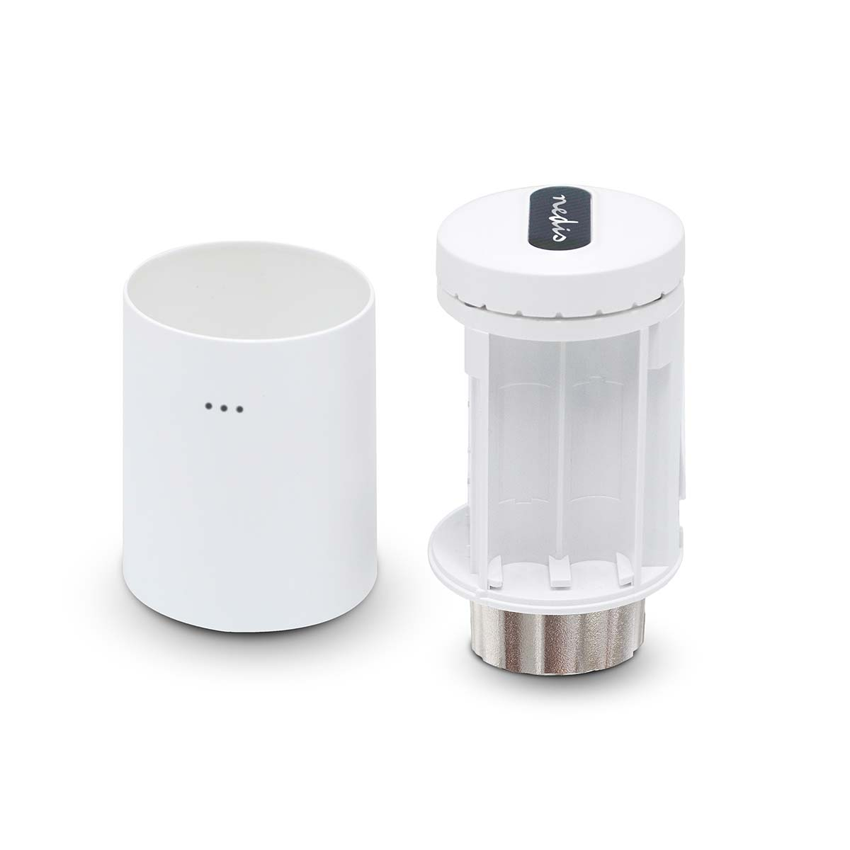 White cylindrical container with three dots next to a disassembled white device with transparent cylinders.