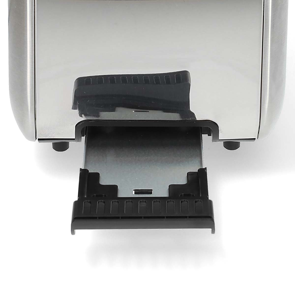 A toaster's crumb tray is pulled out, showing a black tray inside a silver toaster.