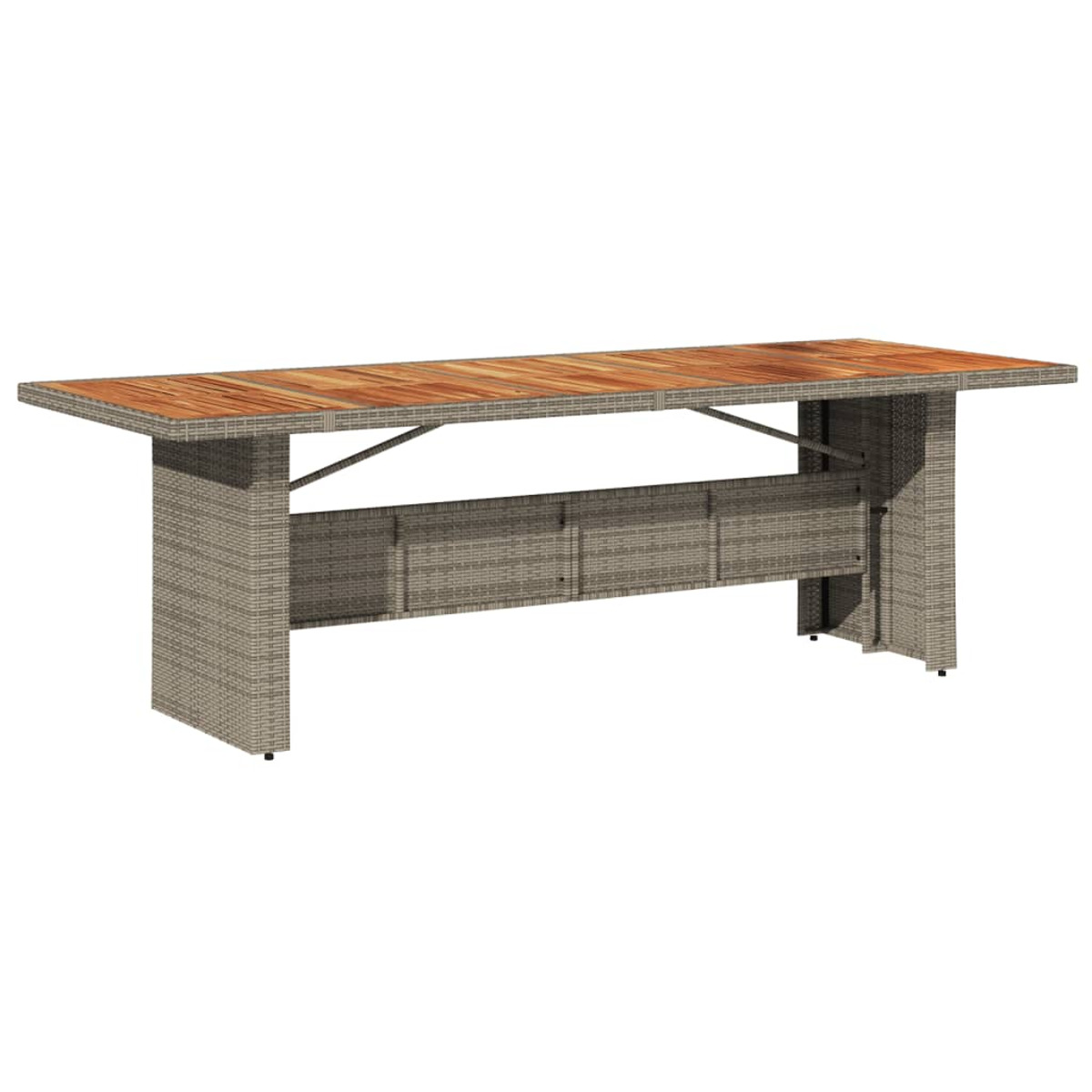 Un lungo tavolo rettangolare da esterno con piano in legno e base intrecciata.