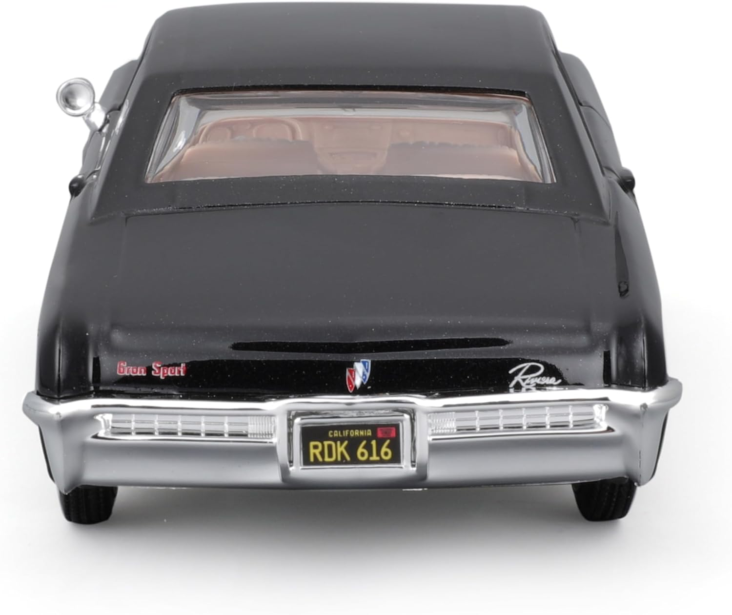 Ein schwarzes klassisches Auto von hinten, mit Nummernschild und Buick-Emblem.