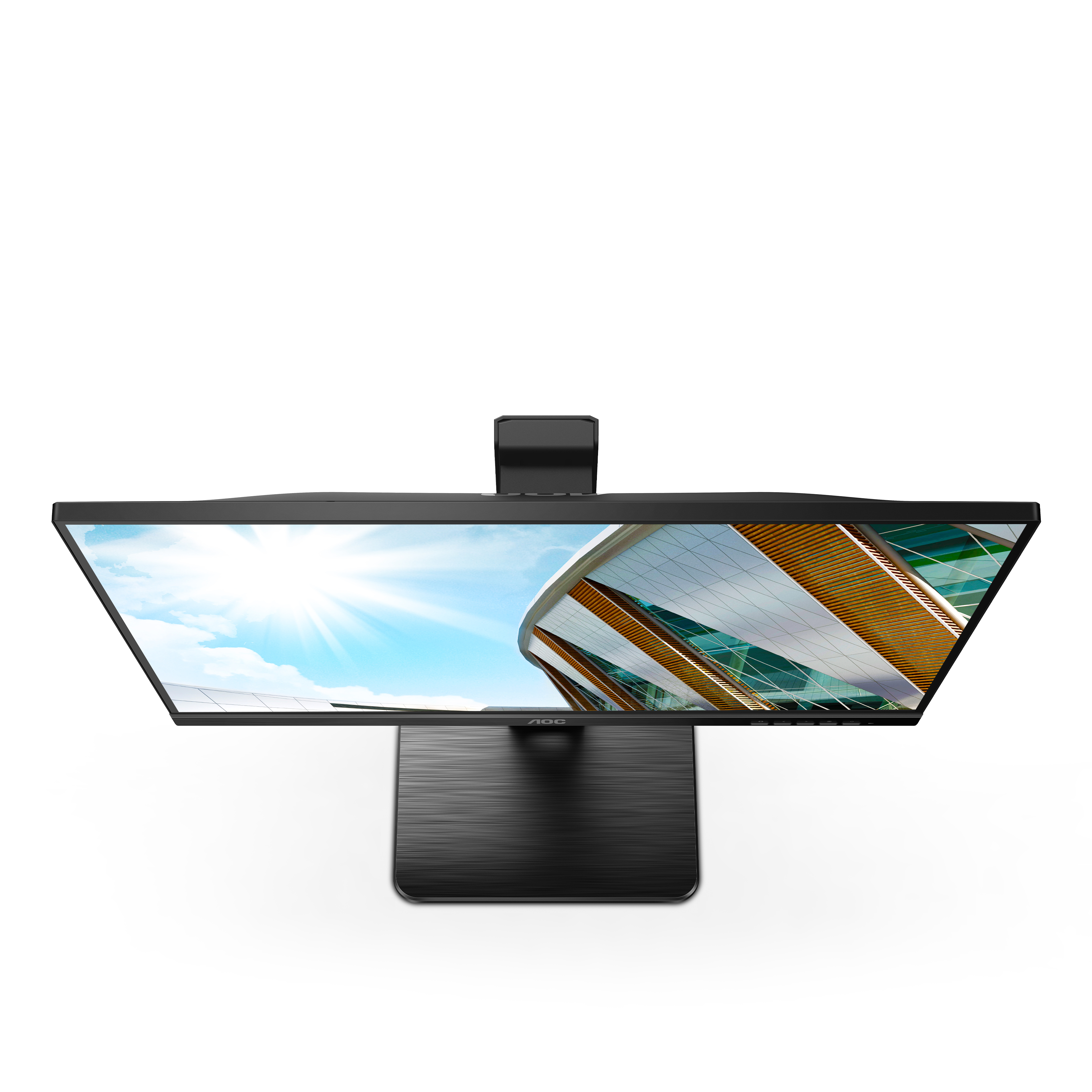 Monitor, marco negro, soporte plateado, vista en ángulo de un edificio con cielo azul.