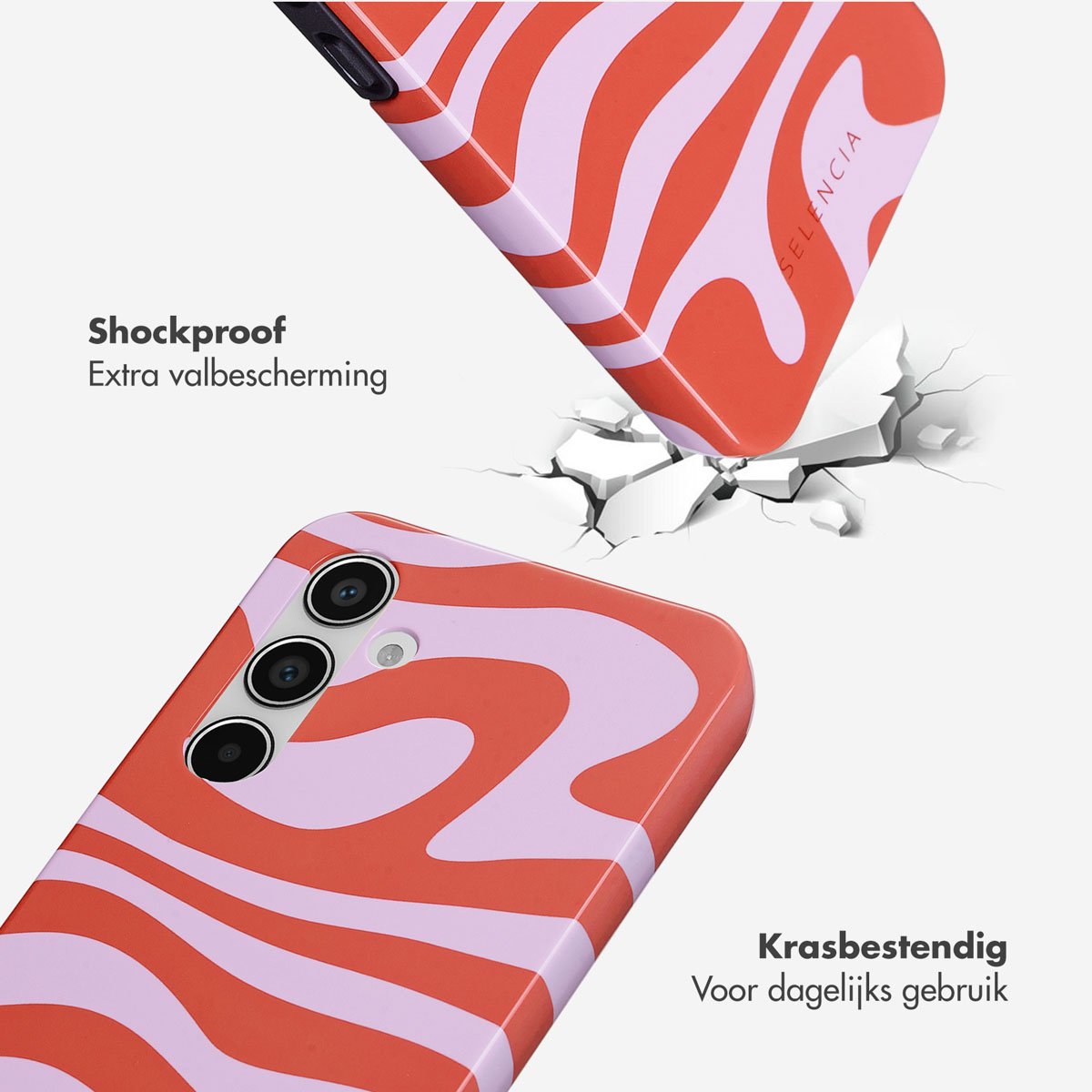 Twee telefoonhoesjes met oranje-paars golvend patroon, één valt op witte scheuren.