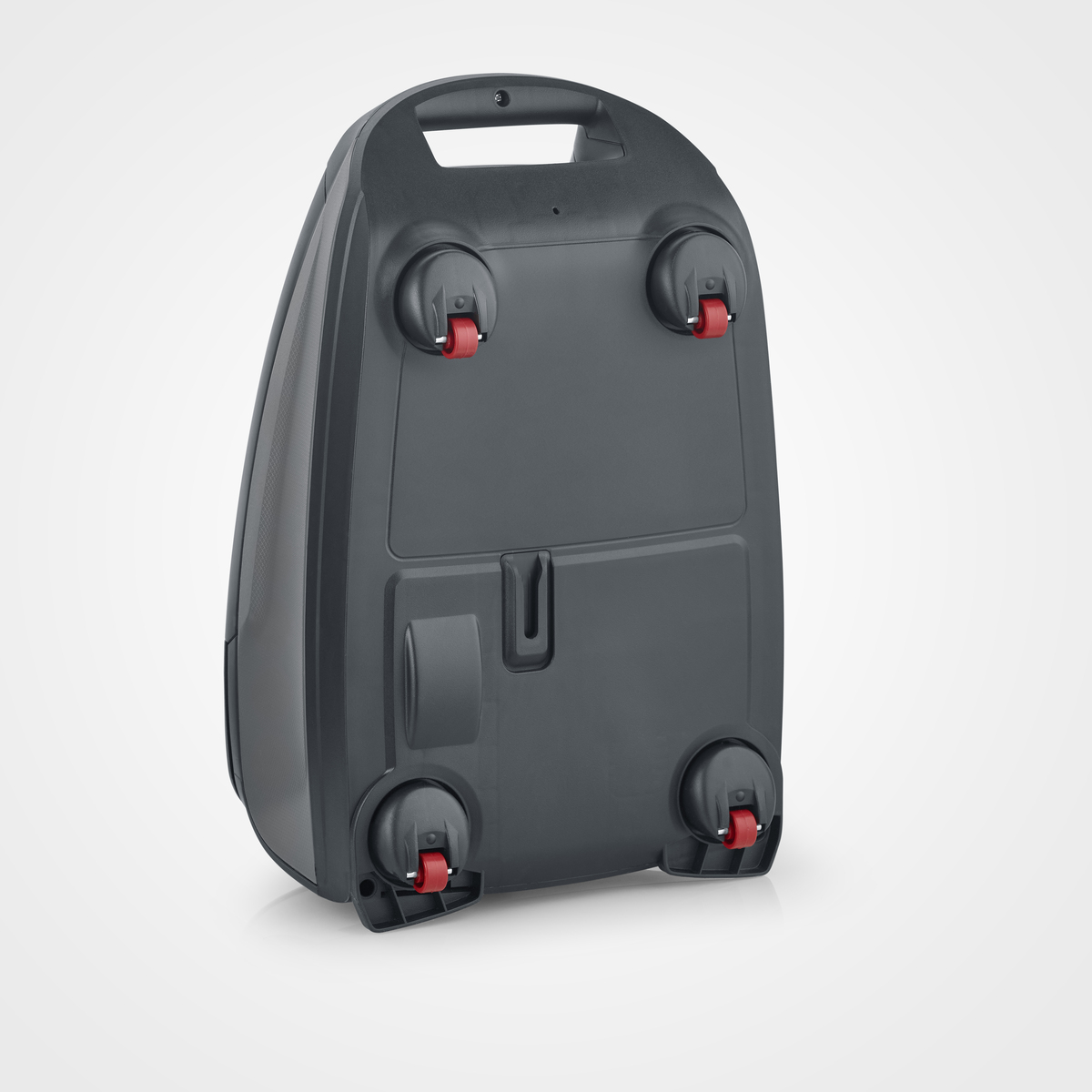 Spód szarego odkurzacza z czerwonymi kołami na białym tle.