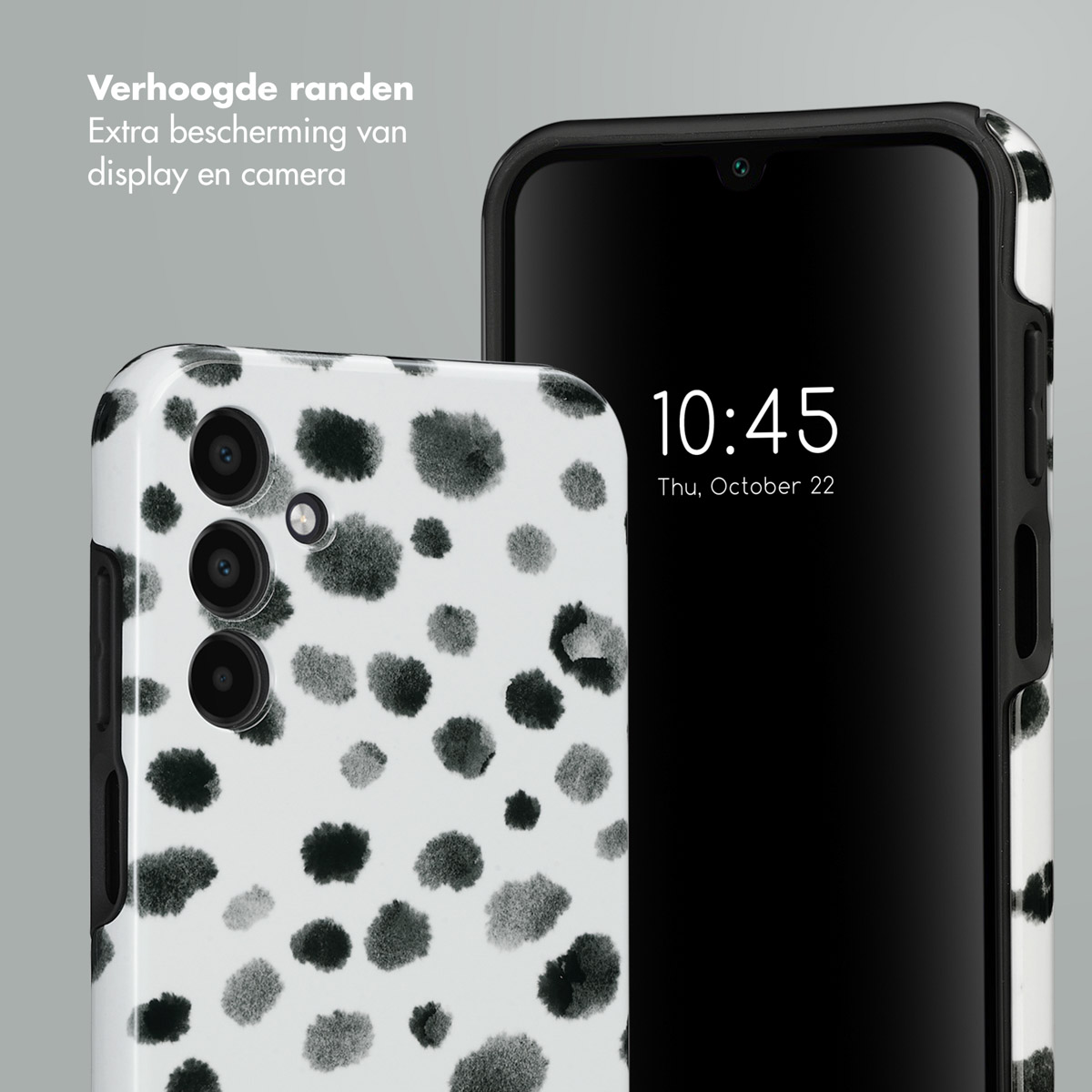 Telefoon met witte hoes met zwarte stippen. Tijd weergegeven: 10:45, do 22 oktober.