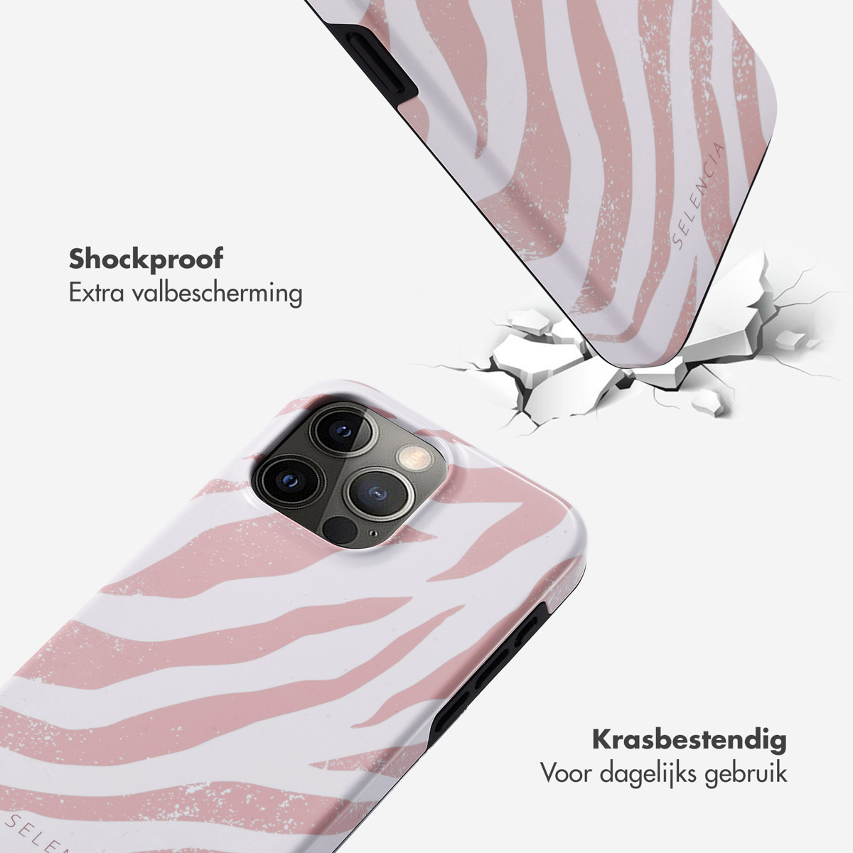 Telefoonhoesje met roze zebra strepen. Een telefoon en een telefoonhoesje liggen op het oppervlak. De hoes is beschadigd.