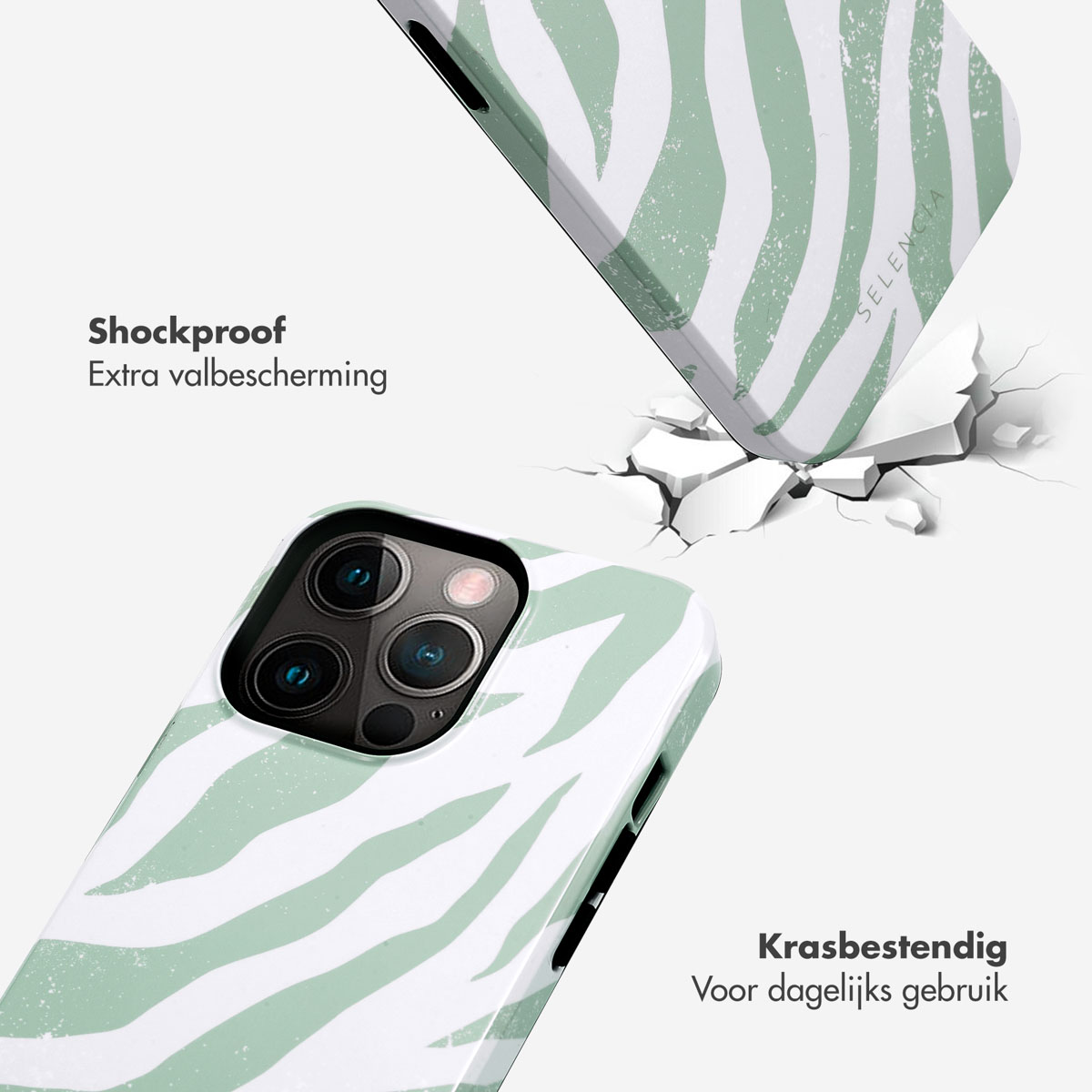Telefoon valt en breekt met groen en witte zebra strepen hoes. Witte achtergrond.