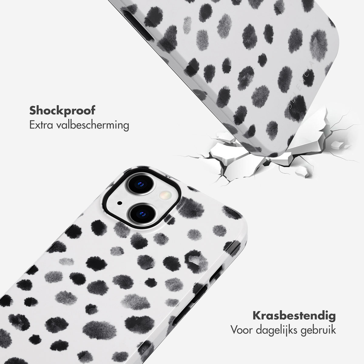 Deux coques de téléphone. L'une tombe, montrant un écran fissuré. Les deux ont un motif à pois noir et blanc.