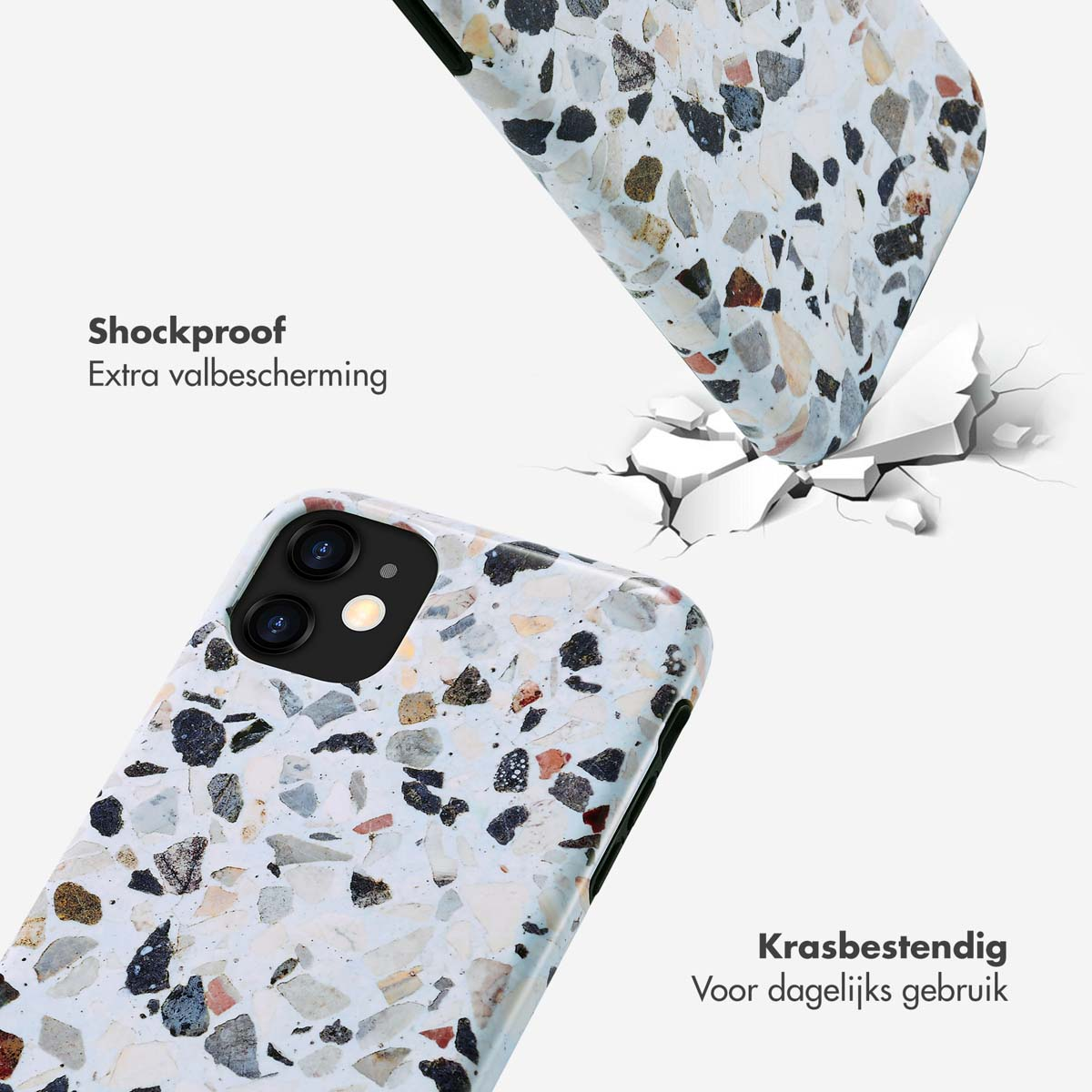 Twee telefoonhoesjes met een gespikkeld design, één valt. Op de achtergrond een gebarsten oppervlak.
