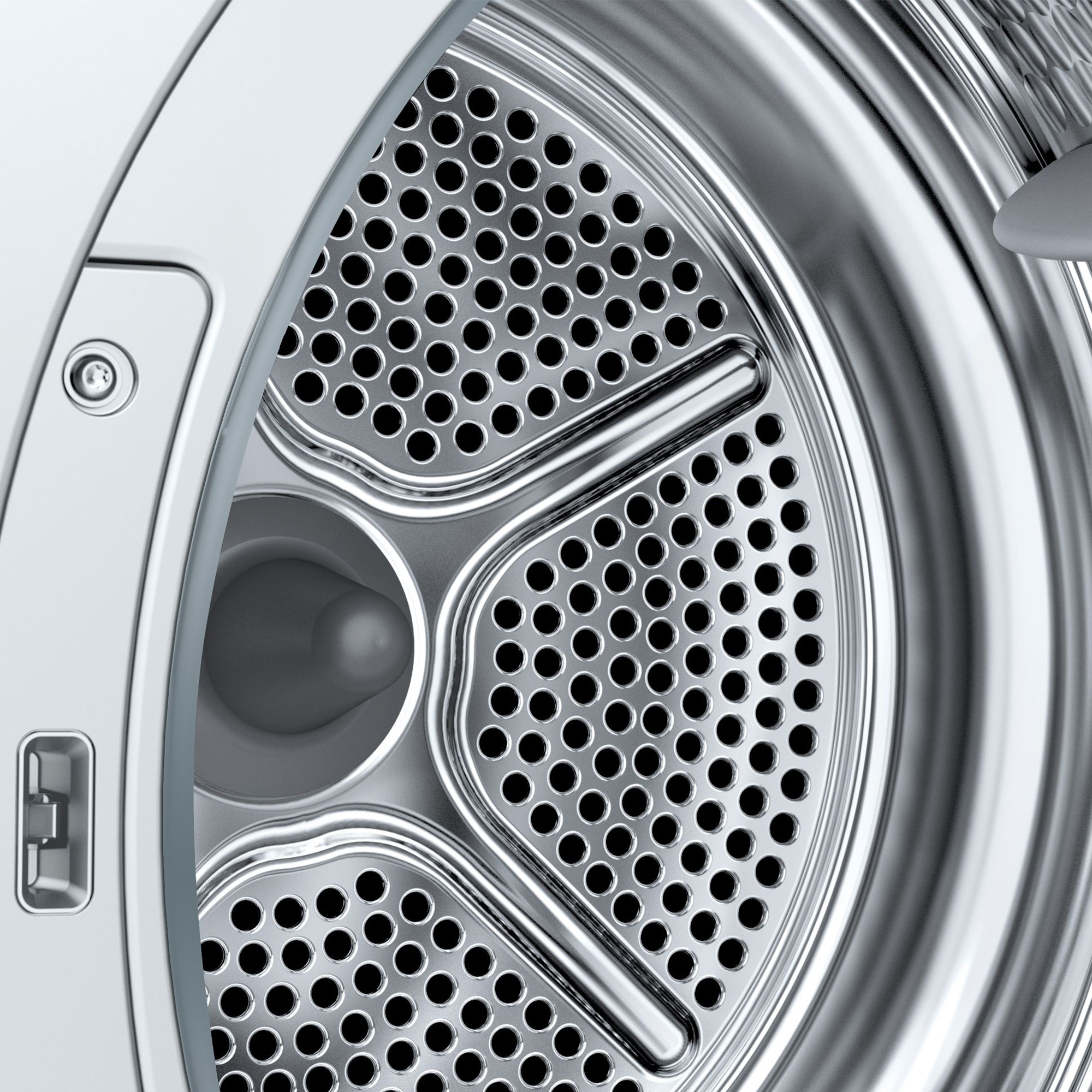 Interno di un cestello di asciugatrice in acciaio inox con molti fori.