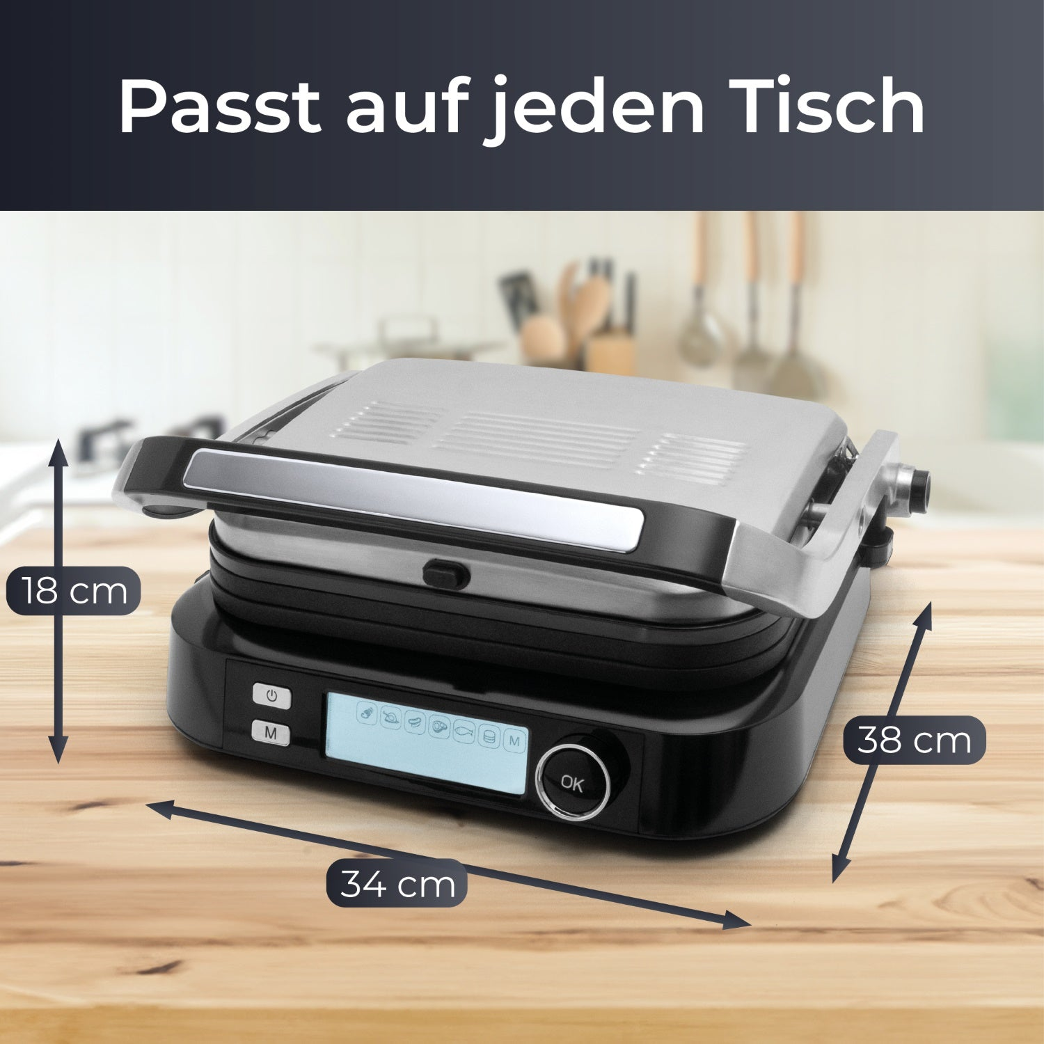 Ein silberner und schwarzer Grill mit Maßangaben. Text sagt: 'Passt auf jeden Tisch'.