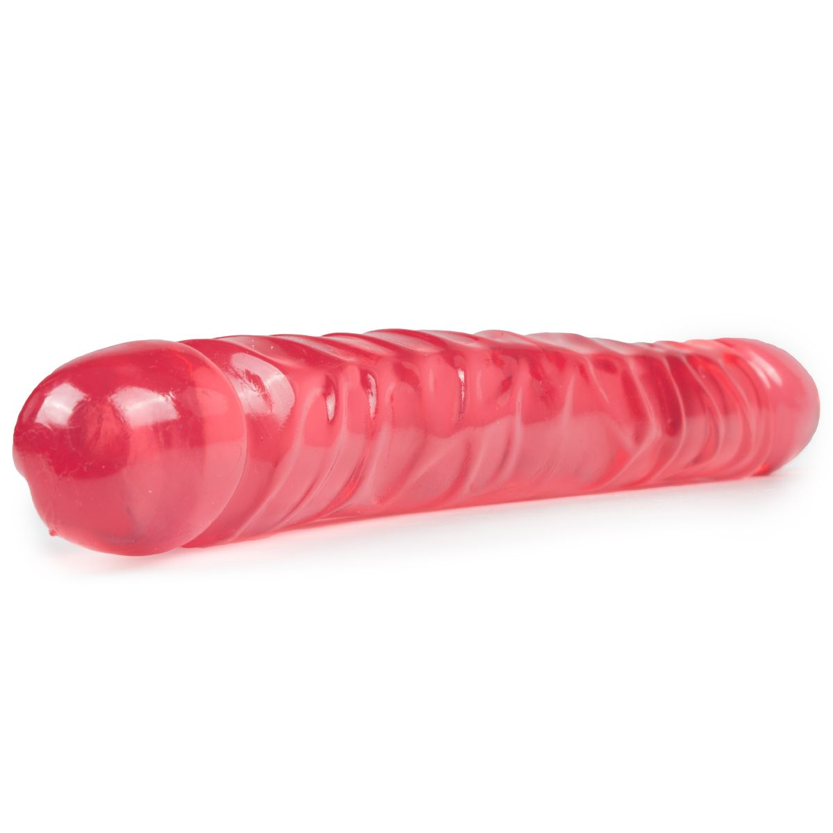 Ein rotes Sexspielzeug, zylindrisch mit Rippen, liegt auf einer weißen Oberfläche.