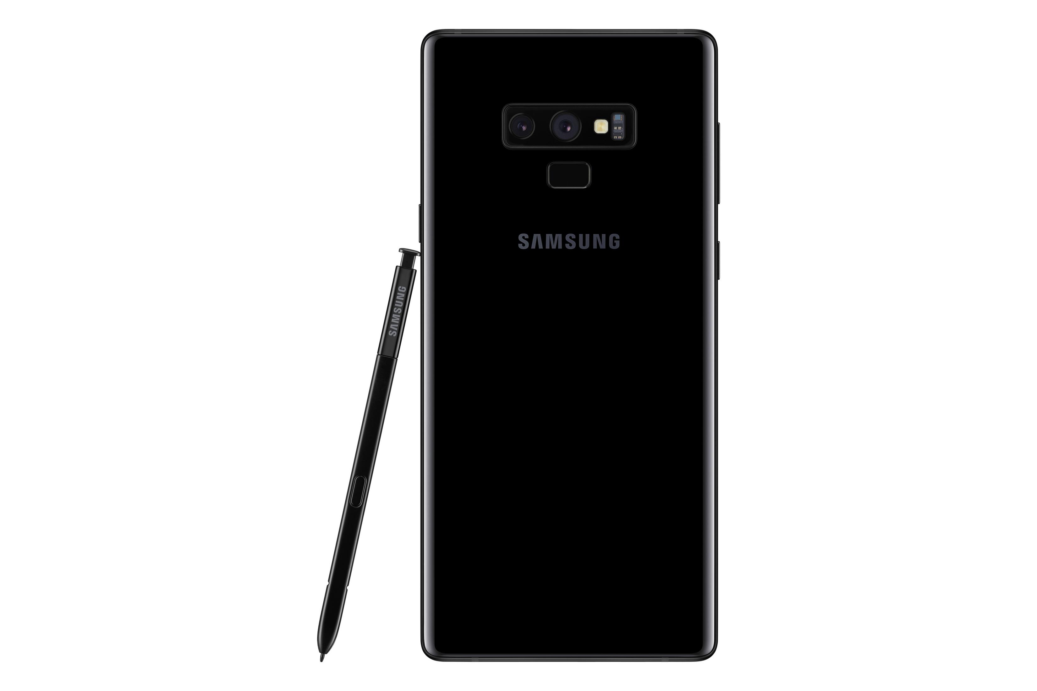 Schwarzes Smartphone mit Stift daneben. Das Telefon hat eine Kamera und das Wort 'SAMSUNG' ist aufgedruckt.