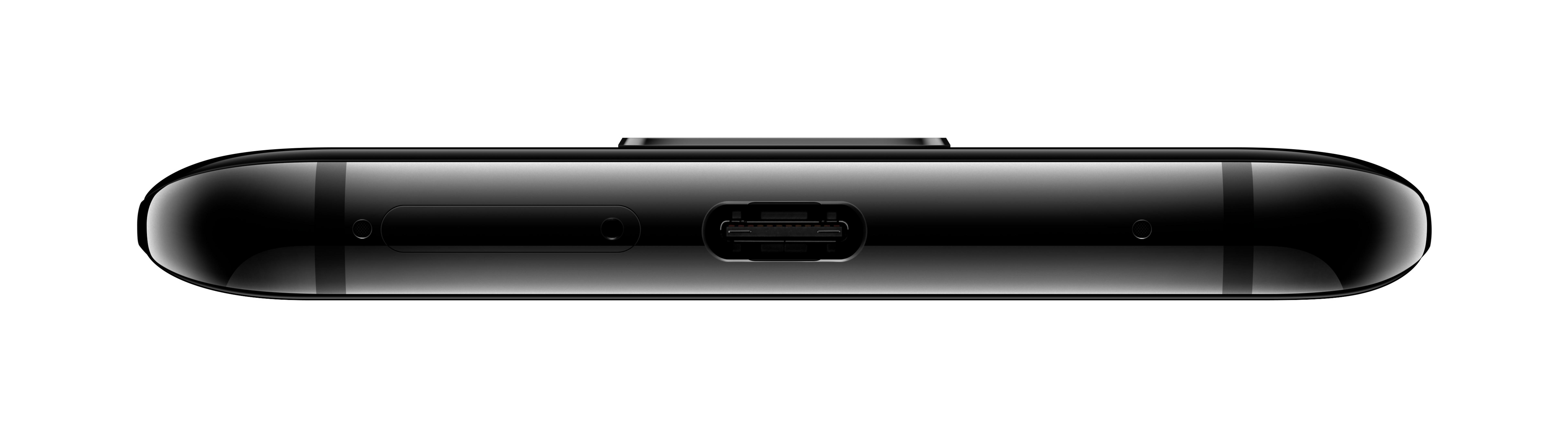 Die Unterkante eines schwarzen Smartphones, die den Ladeanschluss und den Lautsprecher zeigt.
