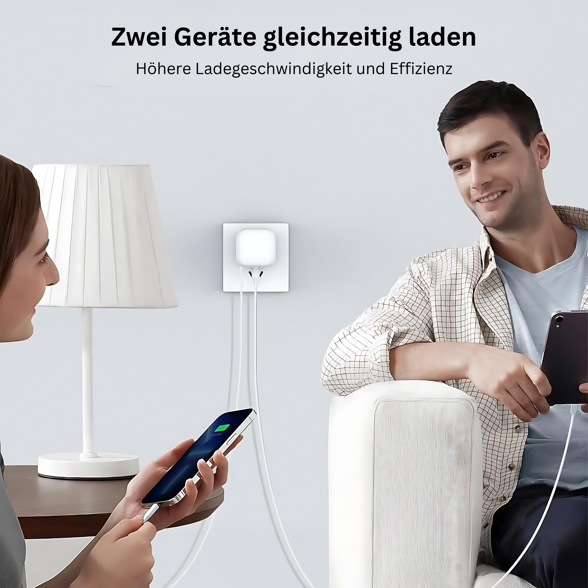 Mężczyzna i kobieta ładujący telefony, z białym gniazdkiem w tle.