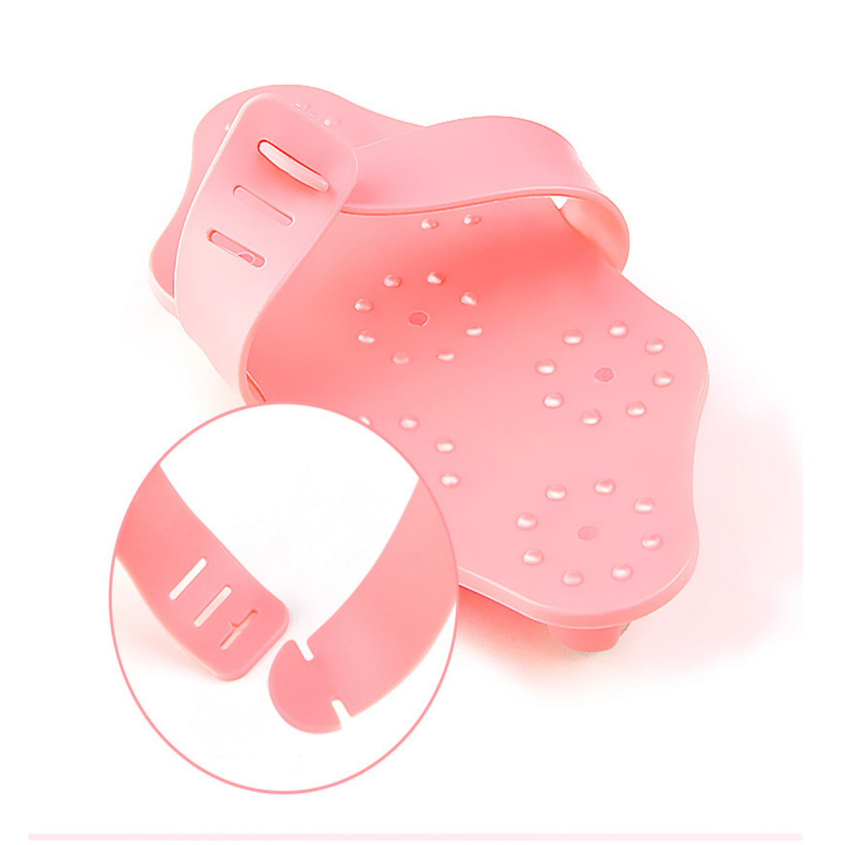 Rosa Fußpflegeprodukt mit Nahaufnahme eines Riemendetails.