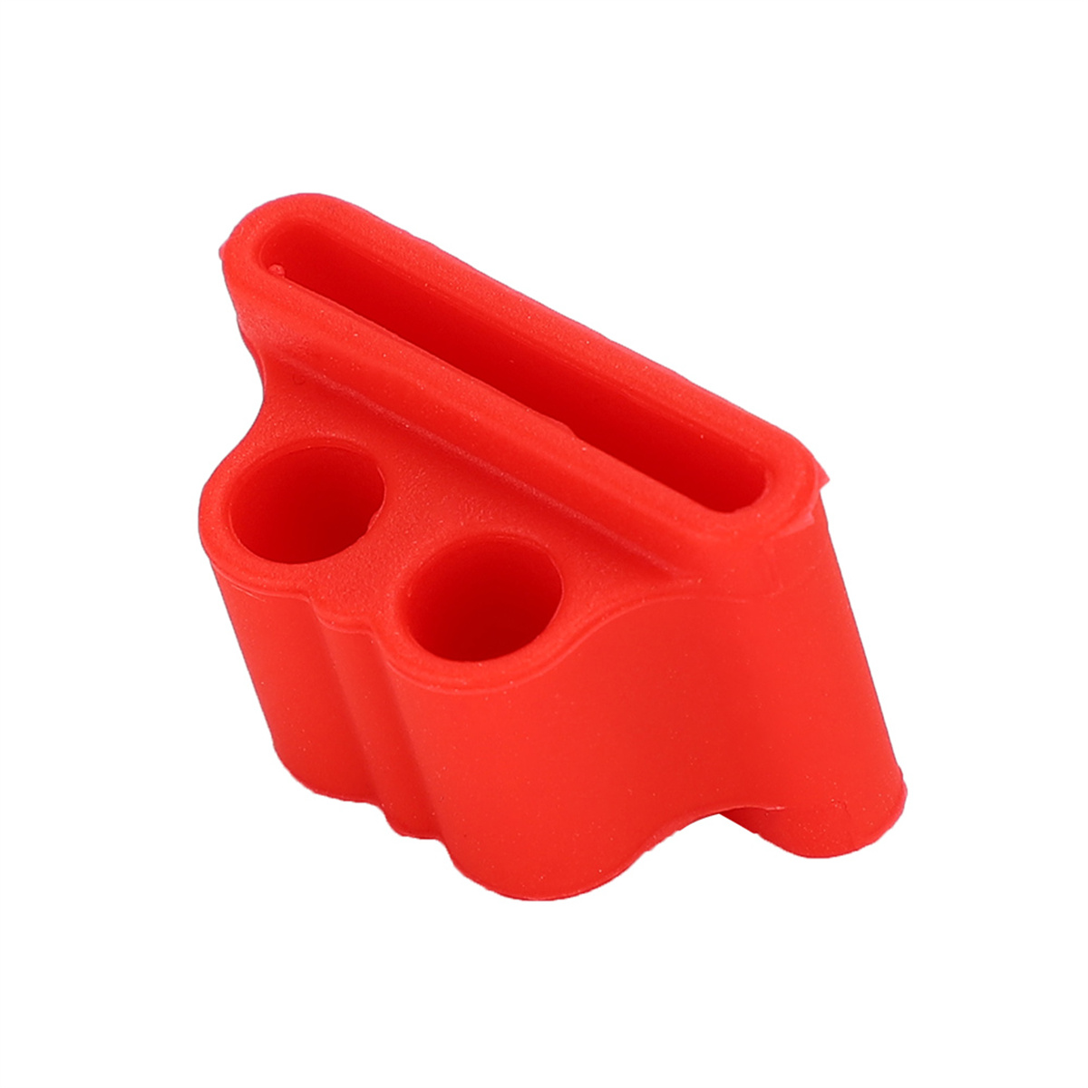 Kleines rotes Gummi-Objekt mit zwei Löchern und einer Rille, isoliert auf weißem Hintergrund.