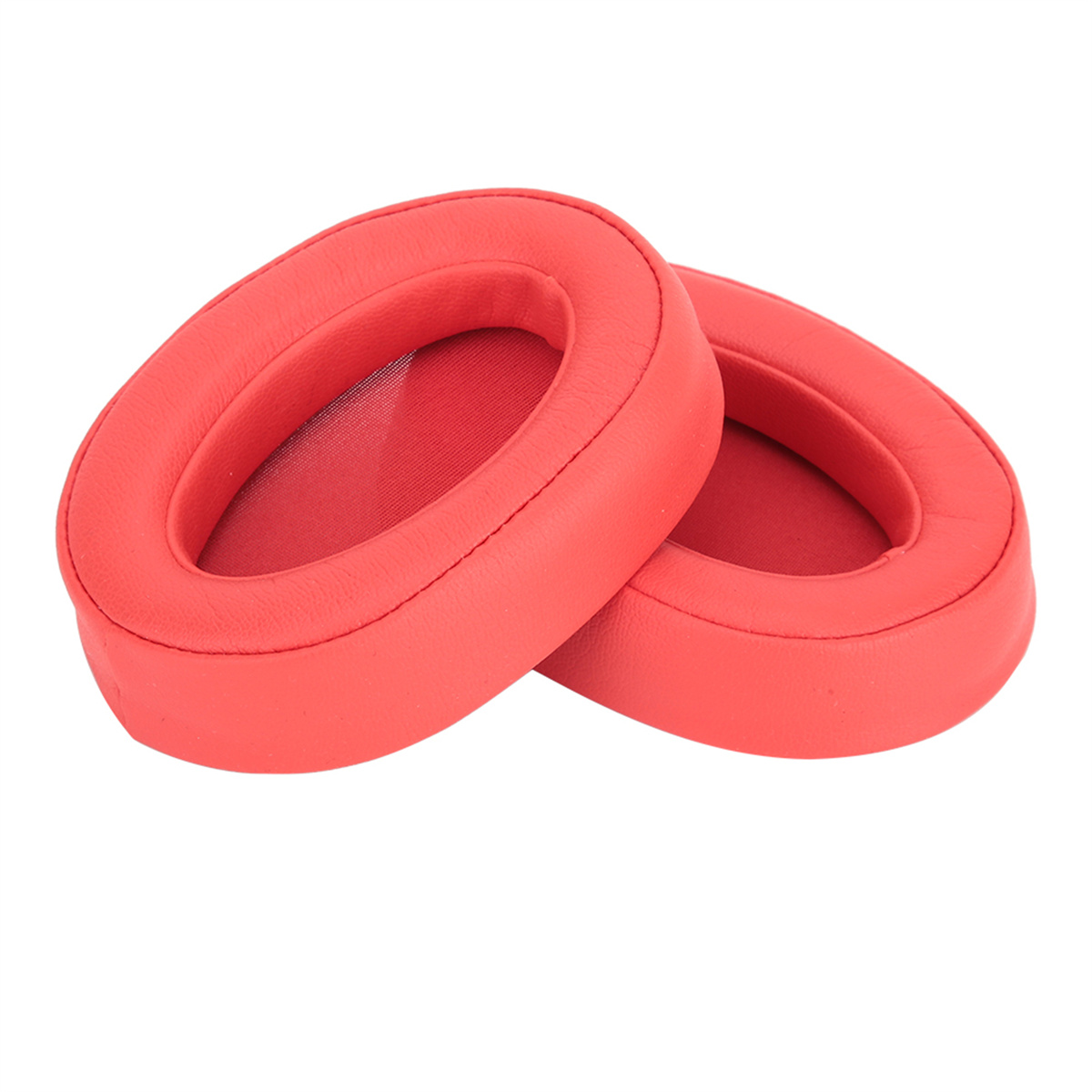 Zwei rote Kopfhörer-Ohrpolster. Die Pads sind oval geformt.