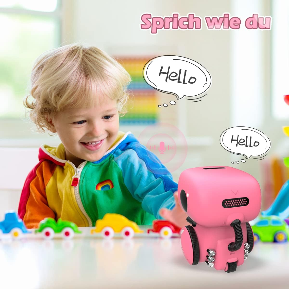 Ein Junge und ein rosa Roboterspielzeug. Der Junge lächelt und der Roboter sagt "Hallo".
