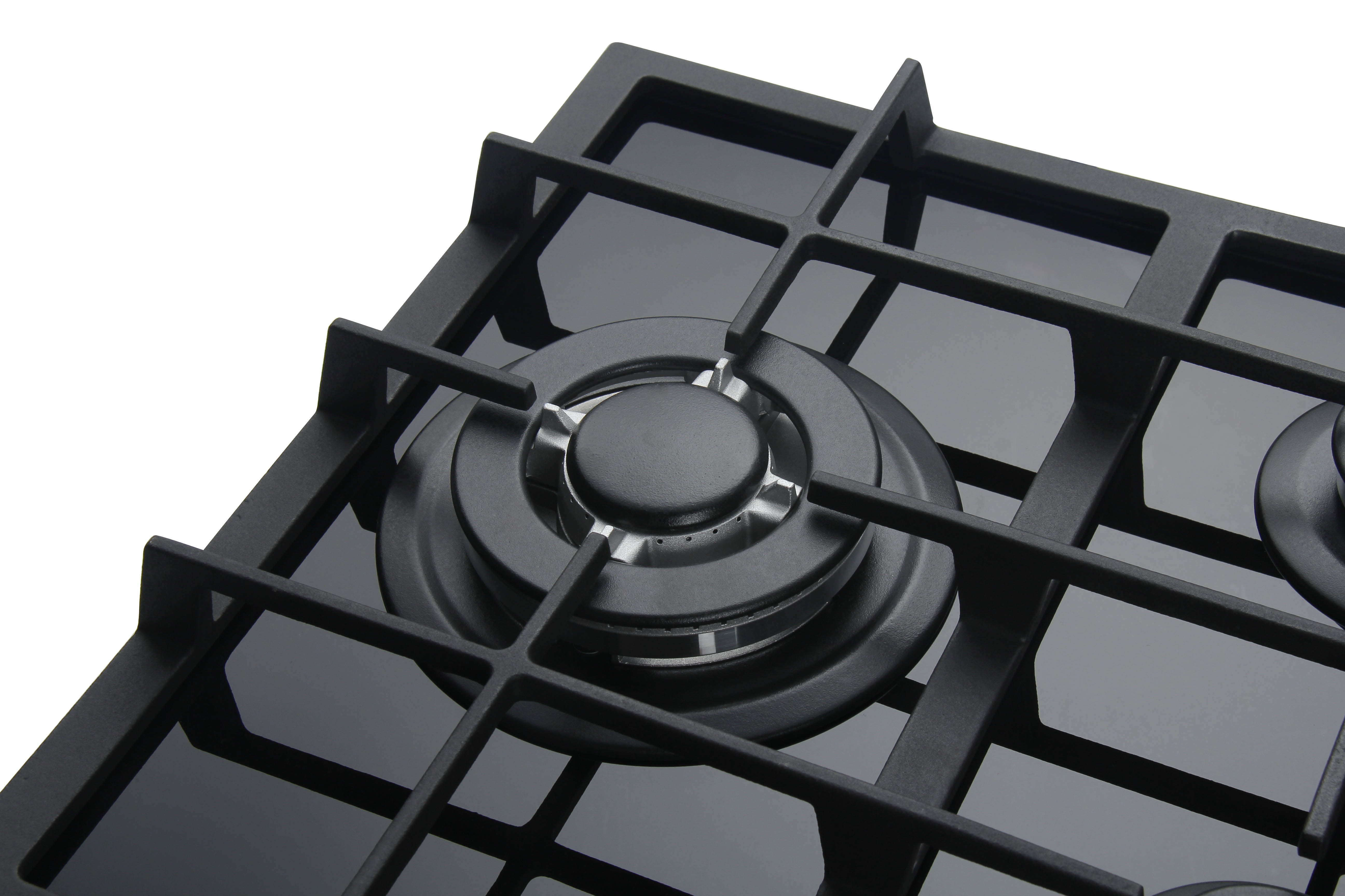 Primer plano de un quemador de cocina de gas negro con superficie de vidrio.