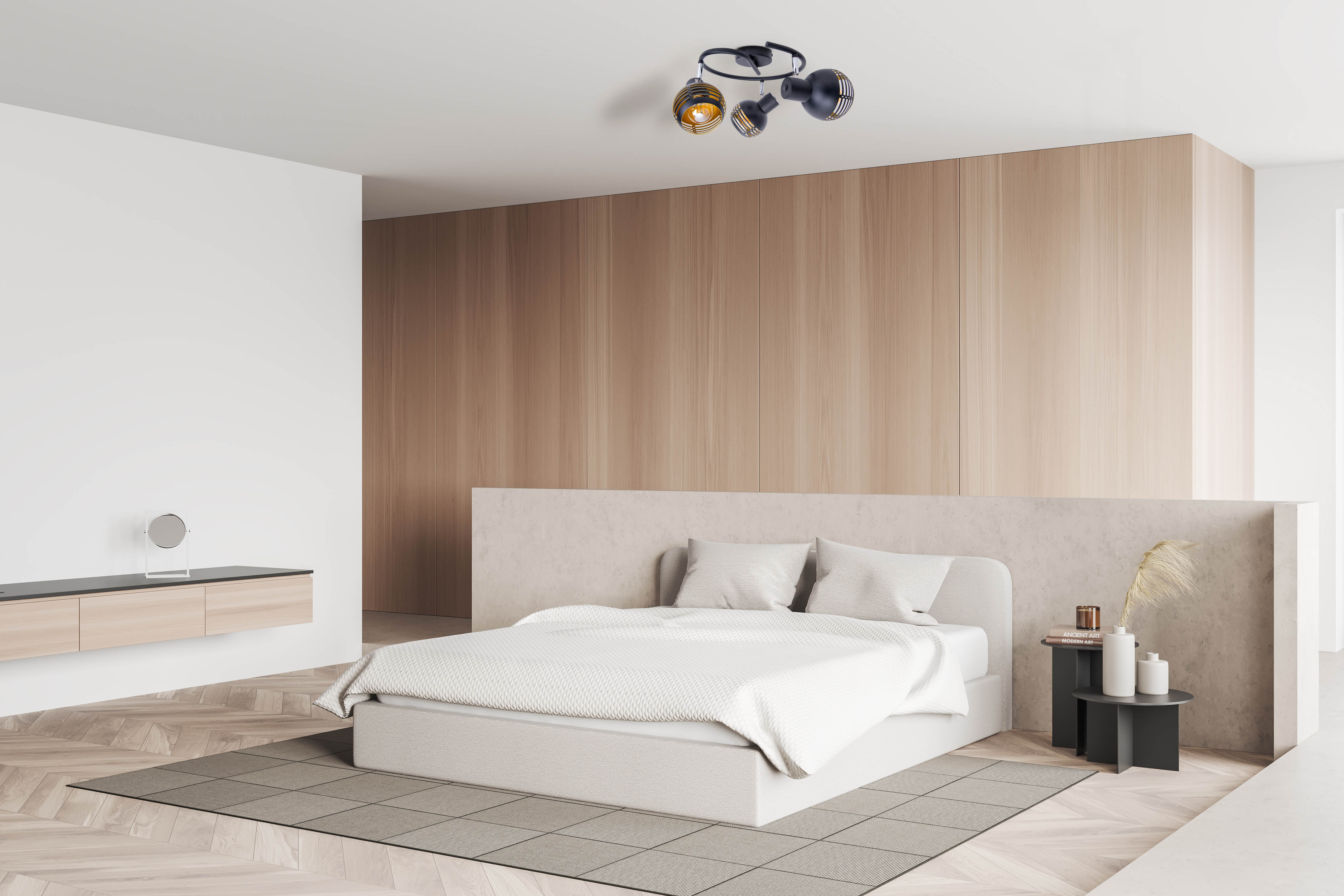 Schlafzimmer mit Bett, Nachttisch, Lampe und Holzverkleidung.