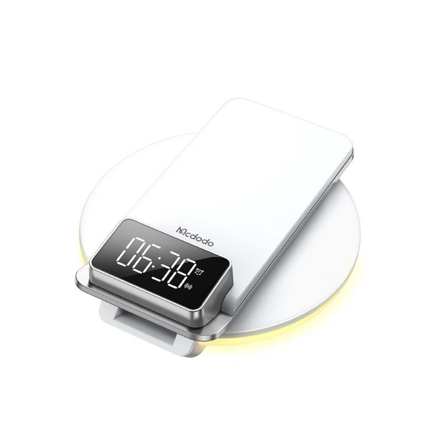Weißes kabelloses Ladegerät mit Uhr. Die Uhrzeit ist 06:38. Der Hintergrund ist weiß.