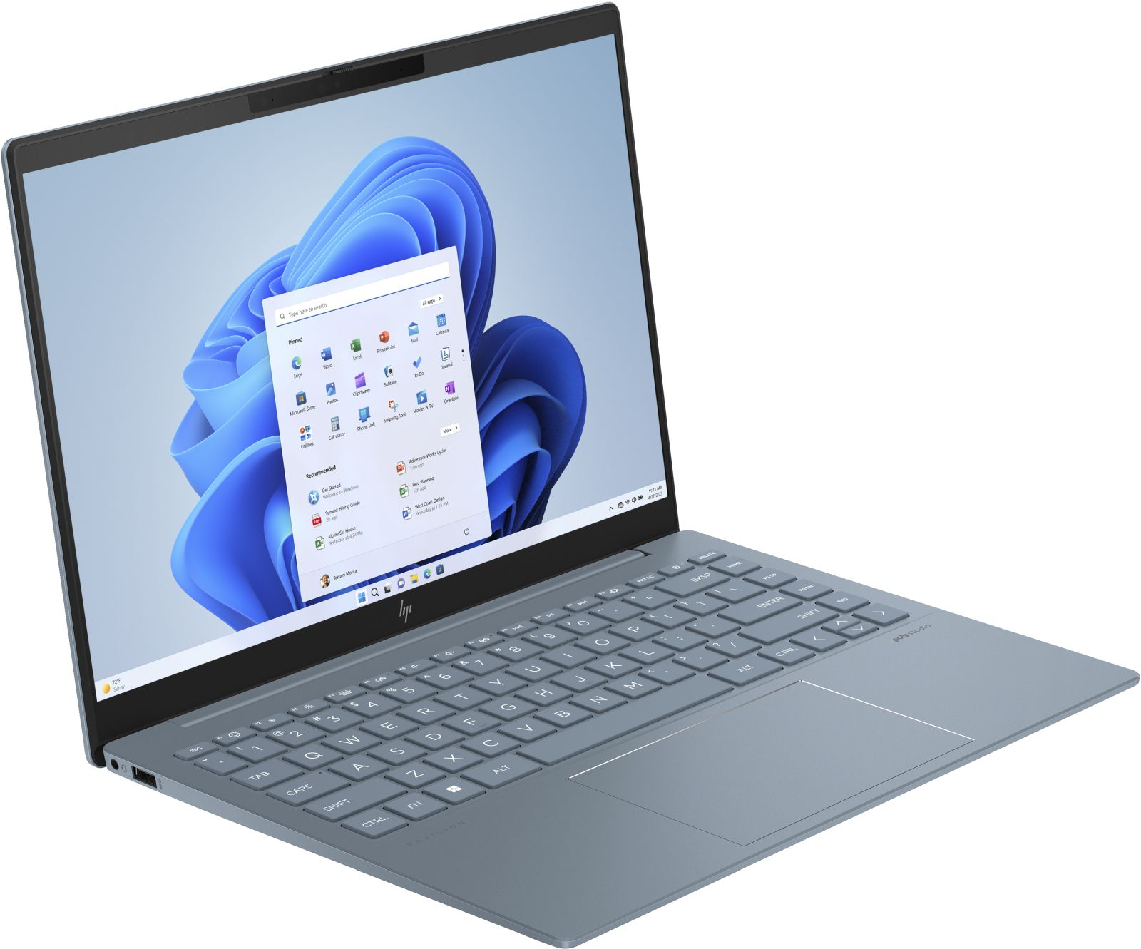 Niebieski laptop wyświetlający interfejs Windows 11 z aplikacjami. Klawiatura i touchpad są widoczne.