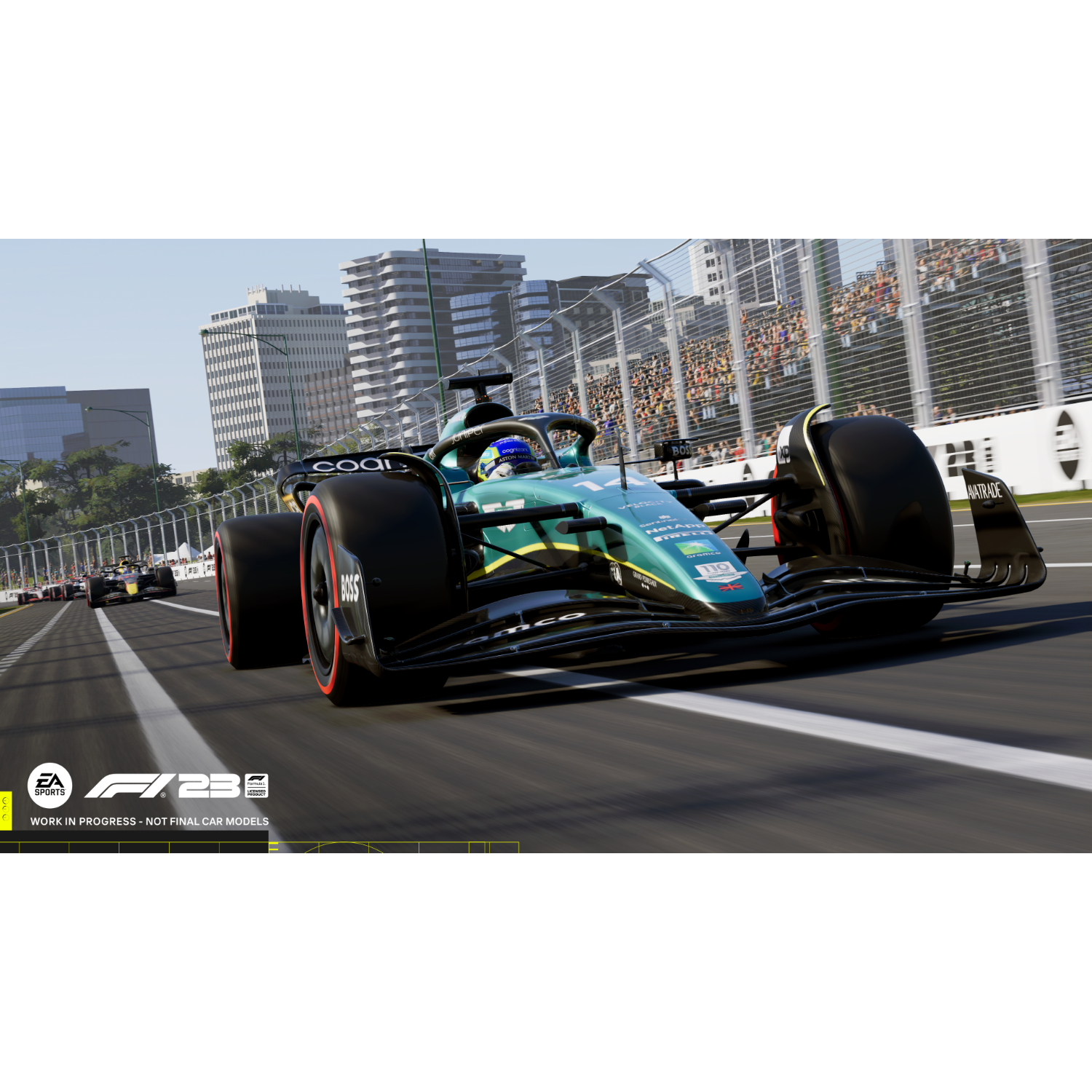 Samochód wyścigowy F1 na torze. Samochód jest zielony i czarny z logo sponsorów.