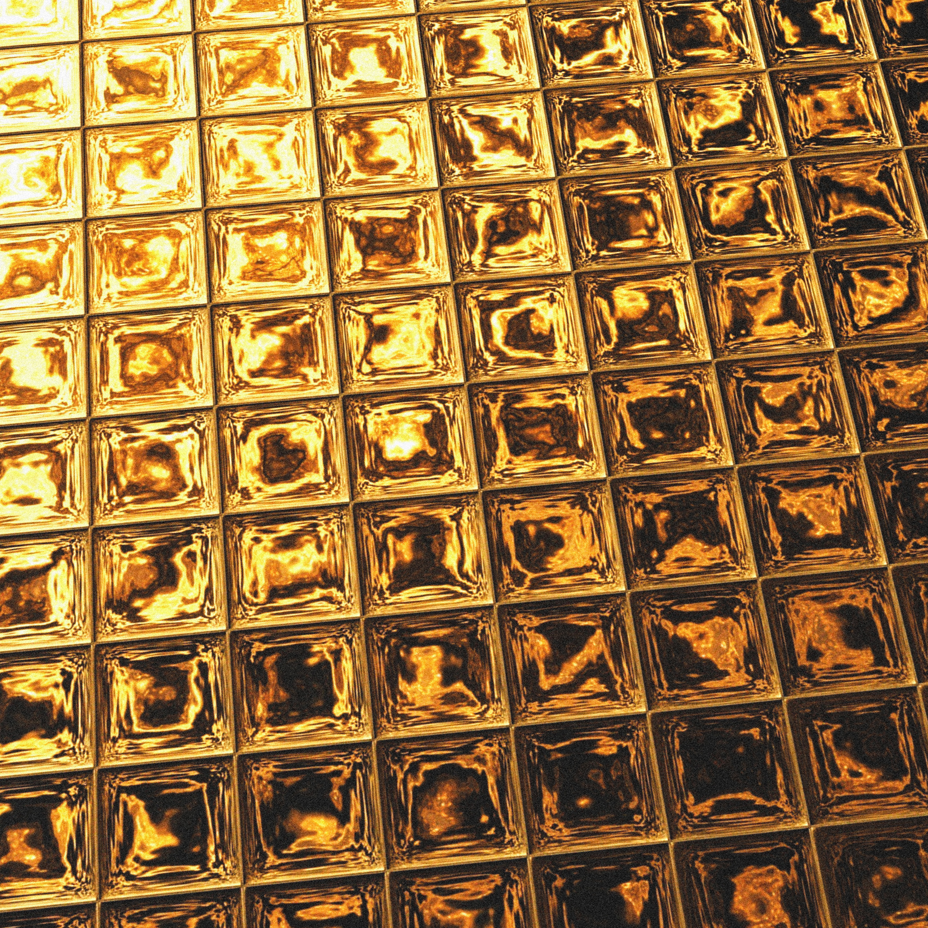 Nahaufnahme einer goldenen, quadratisch gefliesten Oberfläche. Jedes Quadrat reflektiert Licht, mit leichtem Effekt.