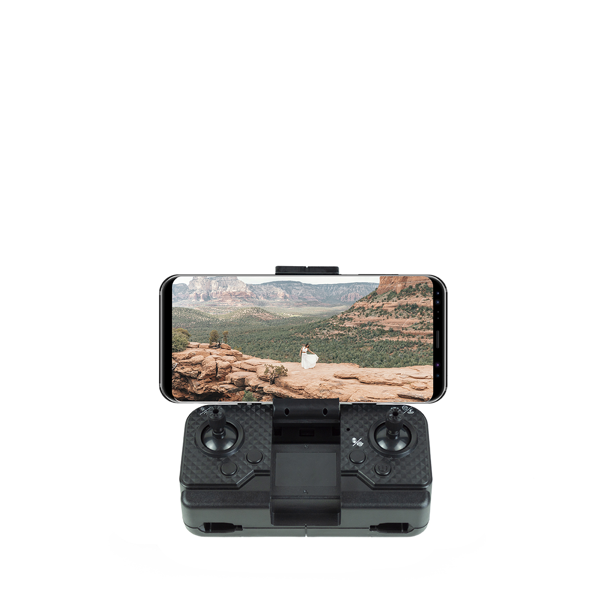 Pilot drona ze smartfonem wyświetlającym malowniczy krajobraz.