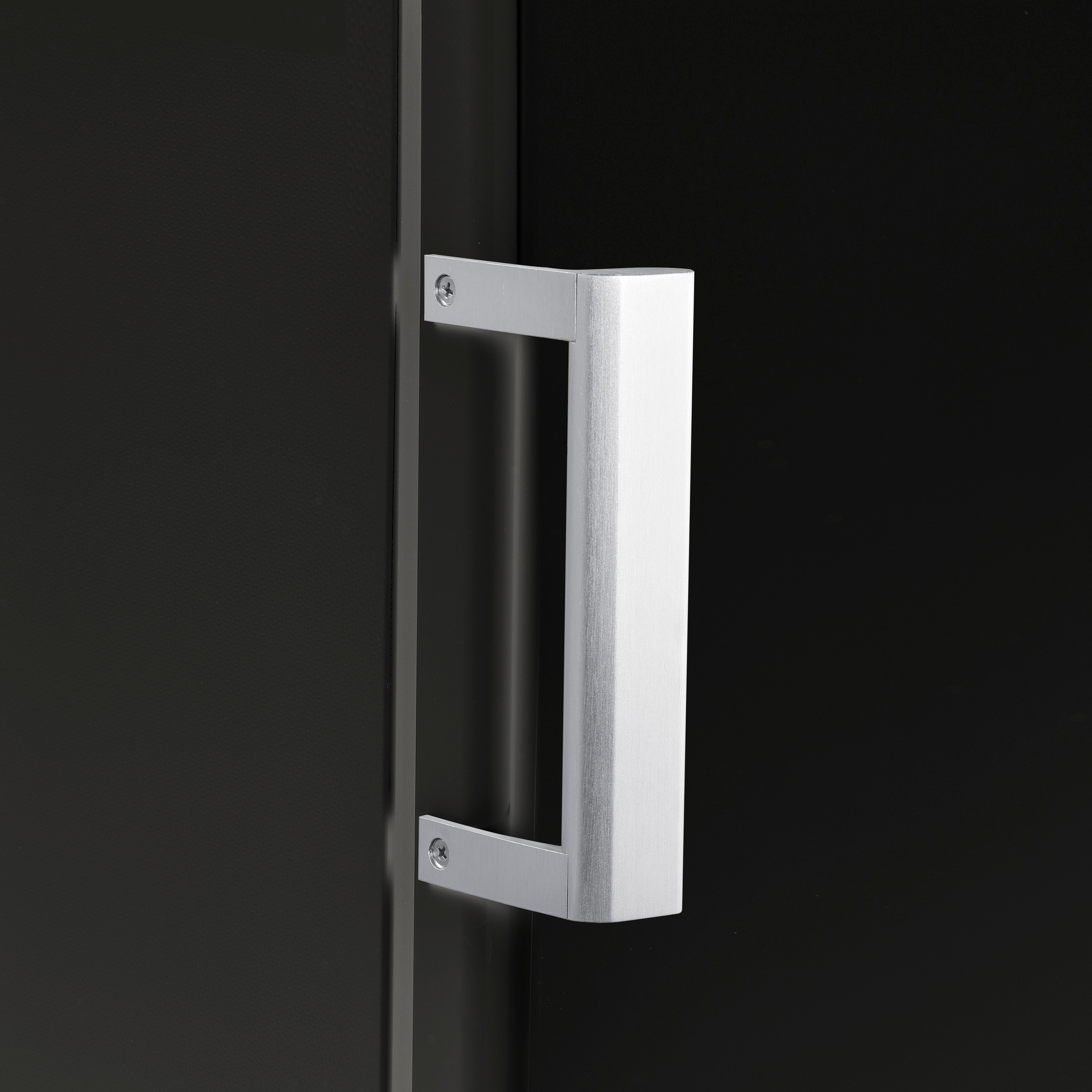 A close-up of a silver handle on a black door, with a simple rectangular design.