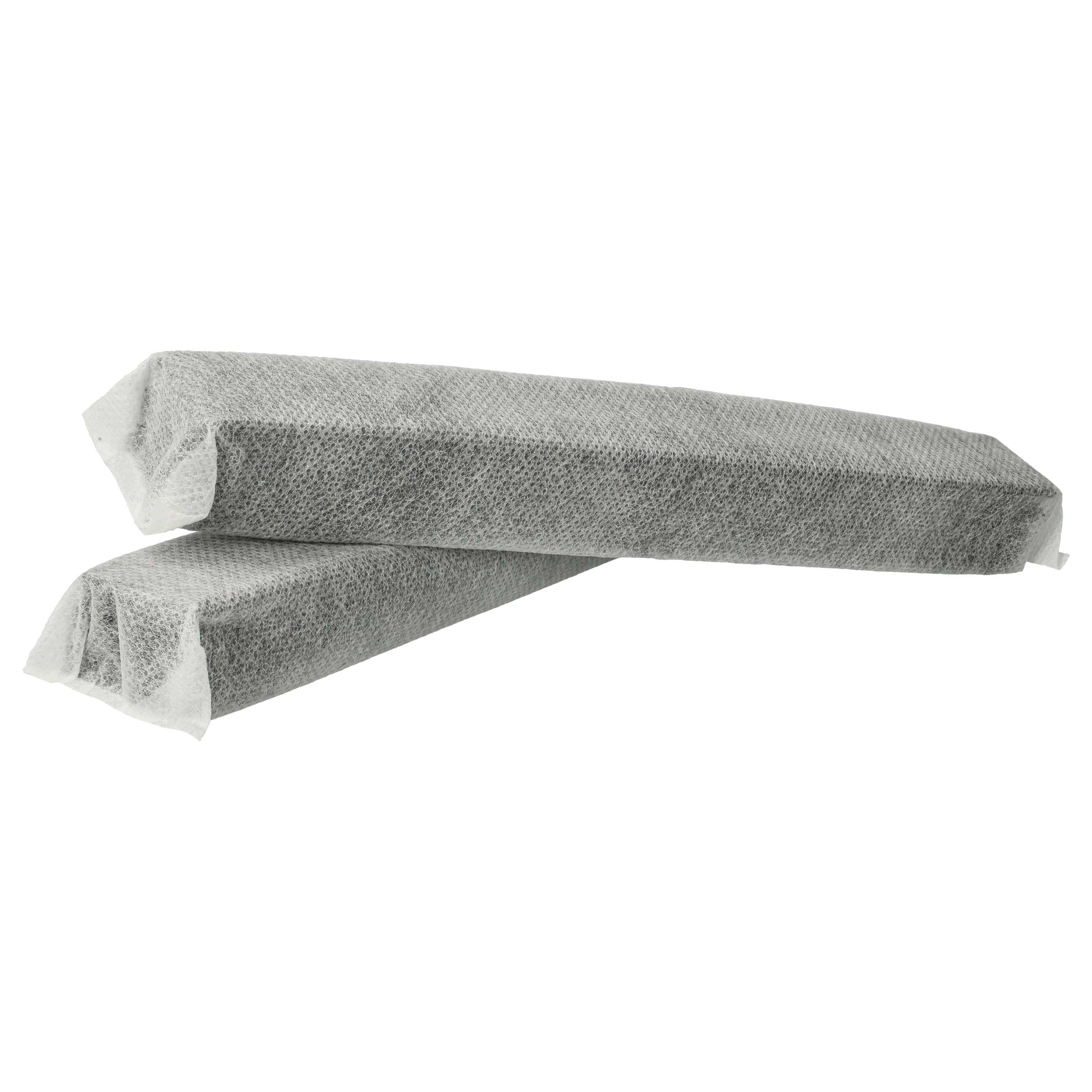 Zwei graue, rechteckige Blöcke, eingewickelt in ein weißes, poröses Material, möglicherweise Verpackung.