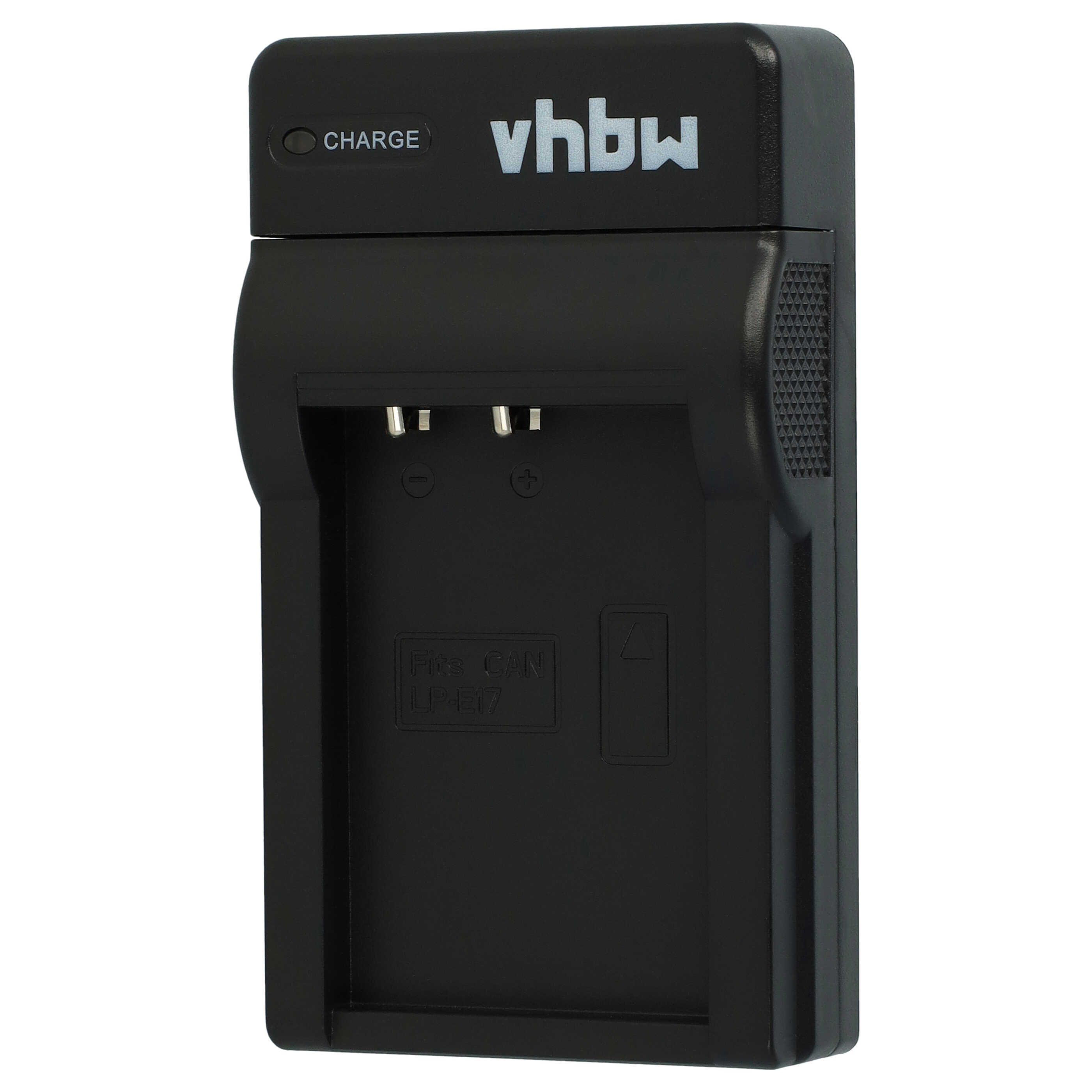 Schwarzes Kamera-Akkuladegerät mit der Aufschrift 'vhbw'. Es hat zwei Schlitze und eine Ladeanzeige.
