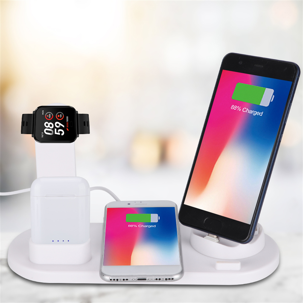 Ladestation mit Smartwatch, Ohrhörern und zwei Handys. Ein Handy zeigt 88% geladen.